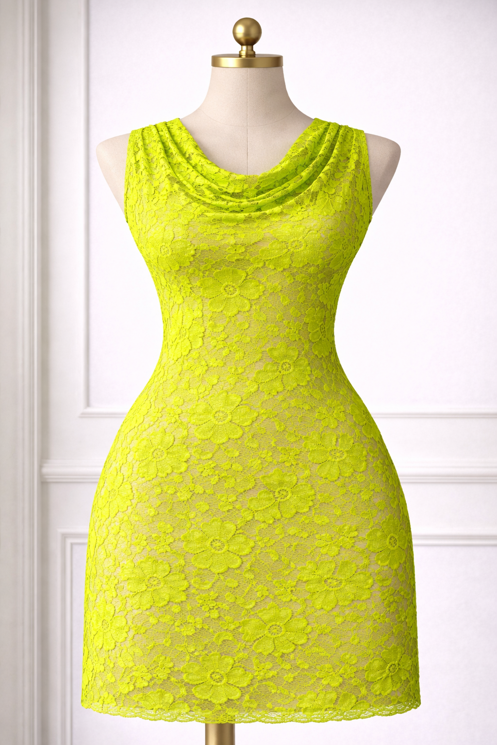 Yellow lace dress on a mannequin against a white background