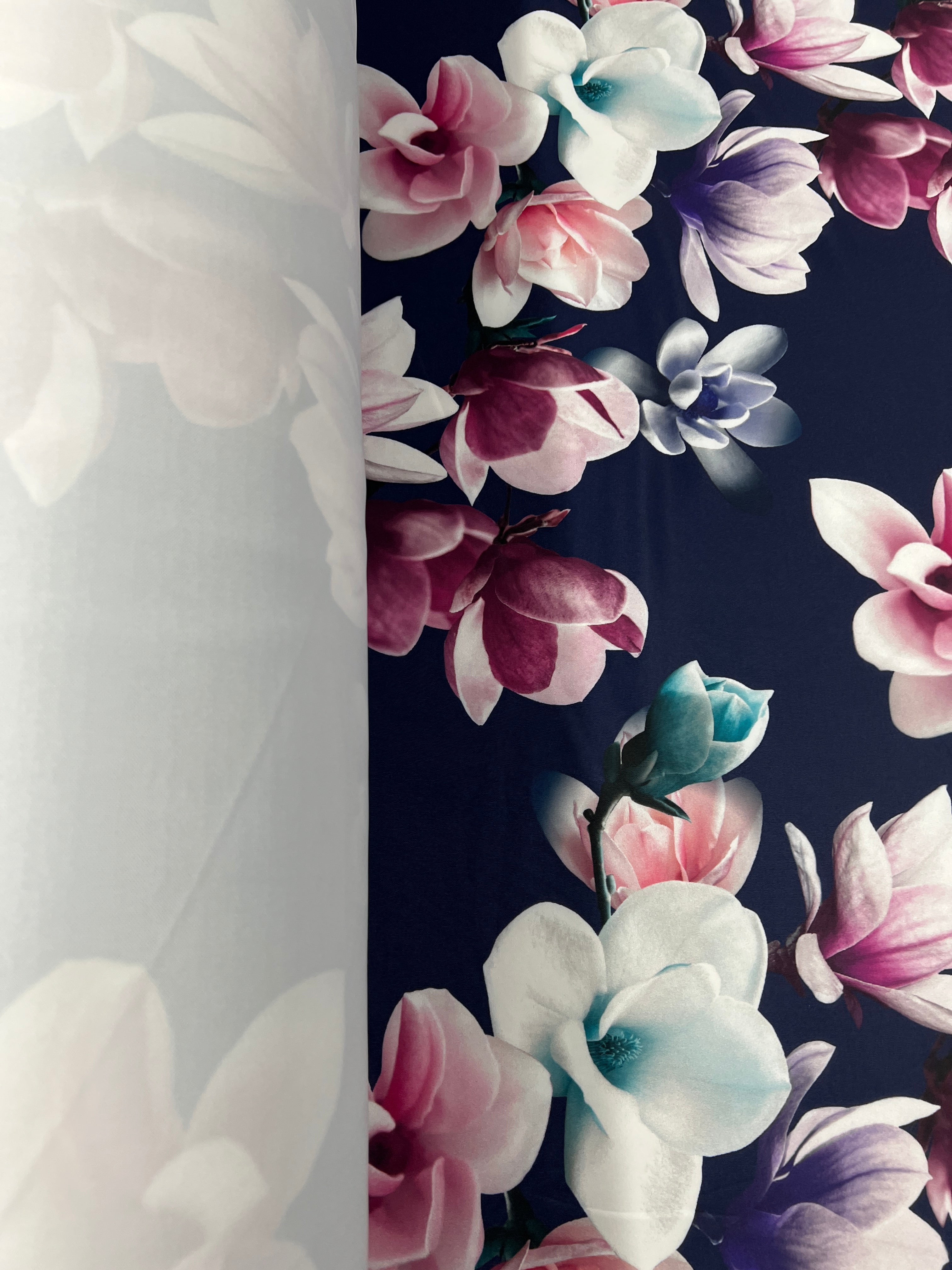 Navy & Blush Magnolia Blossom Floral Scuba Fabric – pink, ivory, lilac and plum magnolias on a deep navy ground