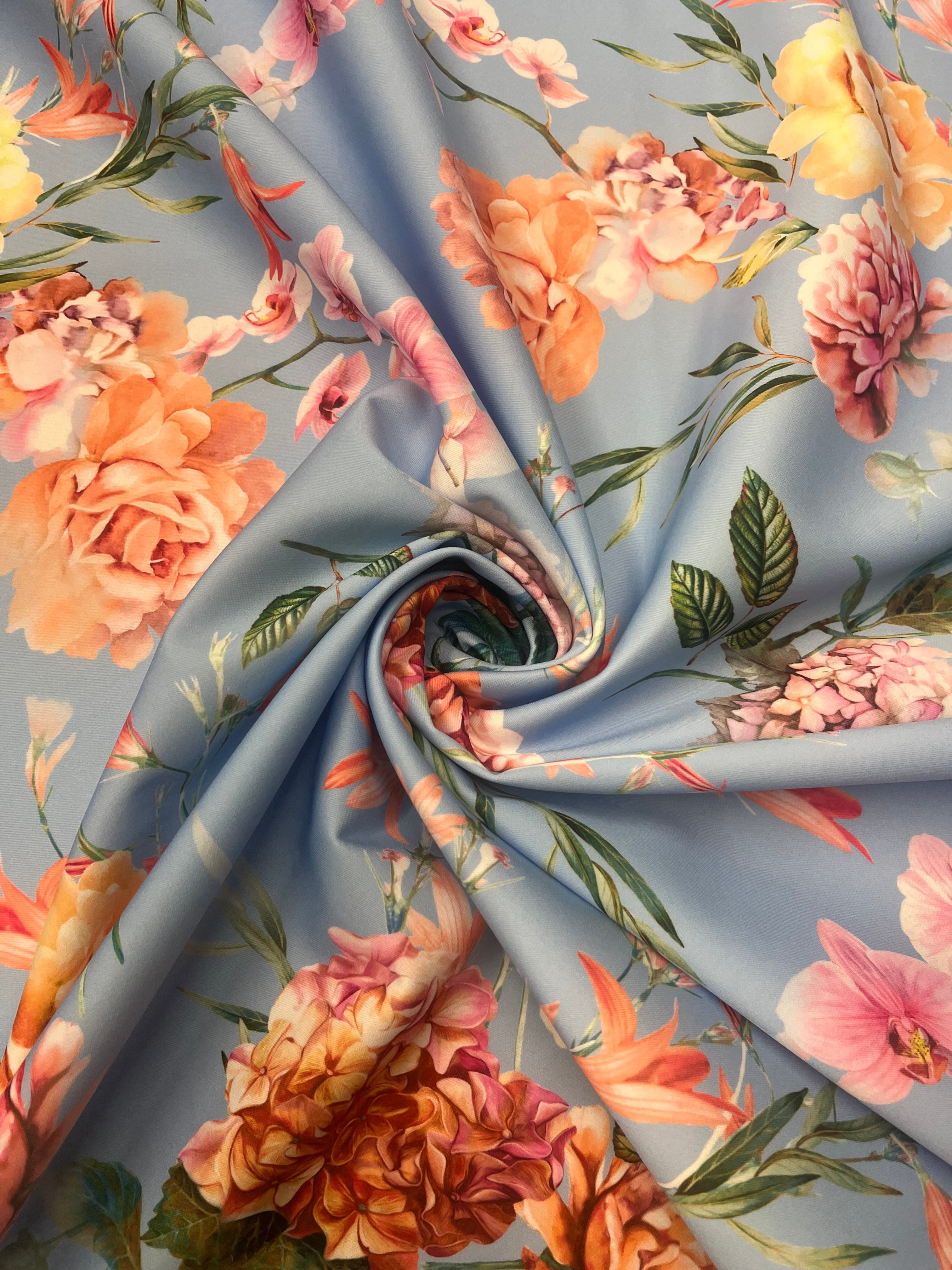 Powder Blue & Peach Garden Rose Floral Scuba Fabric – peach garden roses, yellow peonies and pink orchids on a powder blue ground
