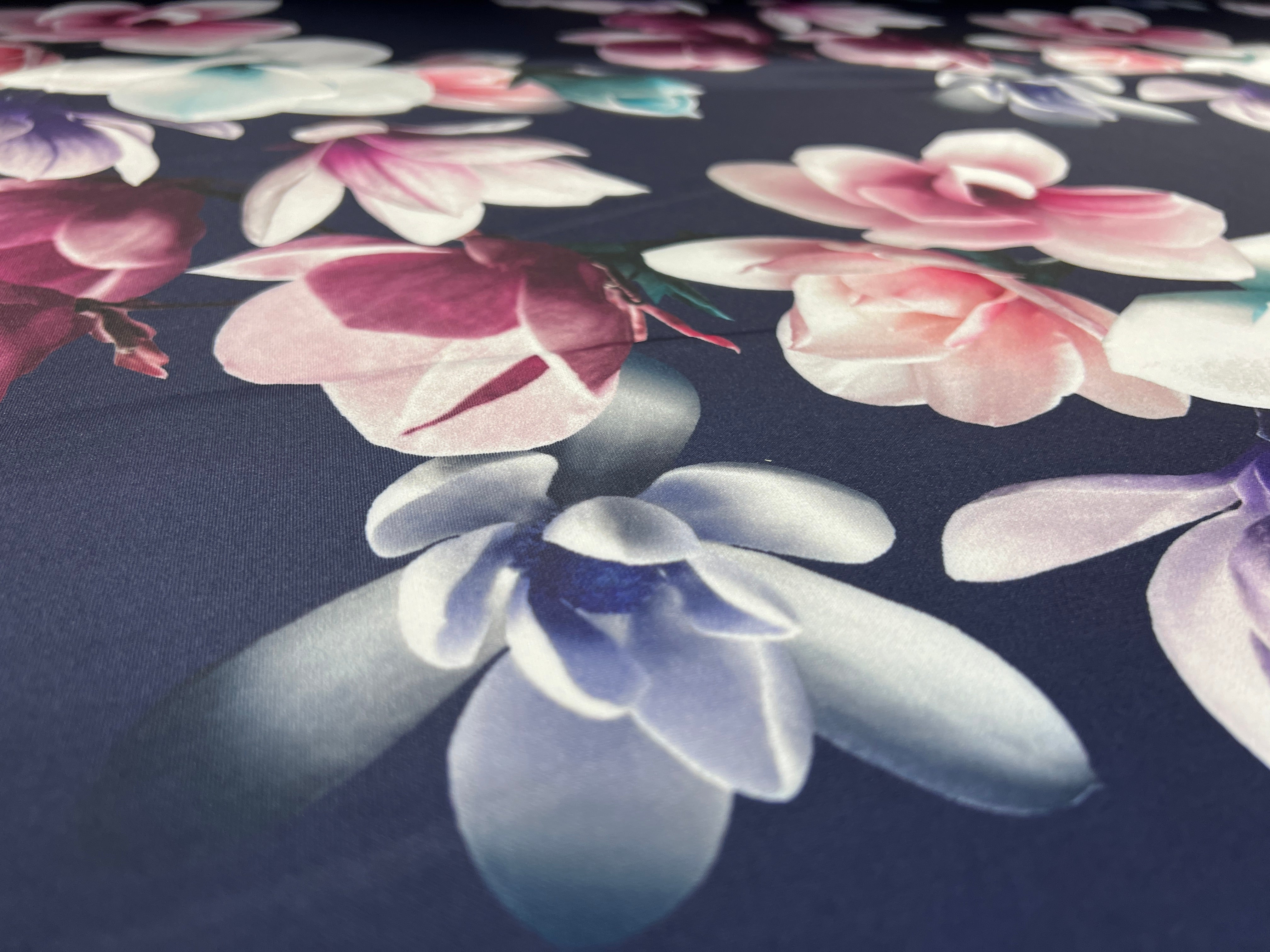Navy & Blush Magnolia Blossom Floral Scuba Fabric – pink, ivory, lilac and plum magnolias on a deep navy ground