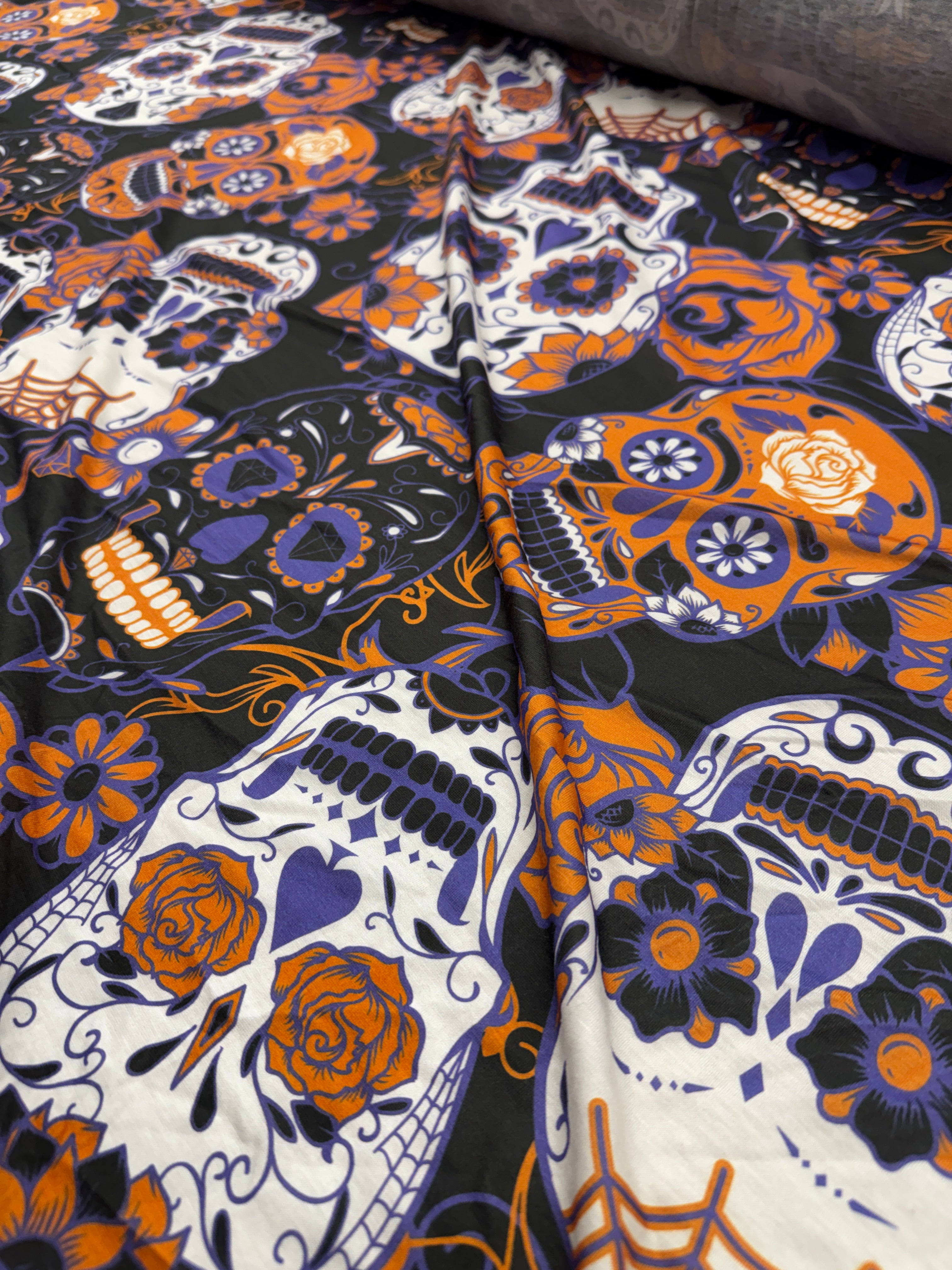 Finished garment made from sugar skull print jersey fabric