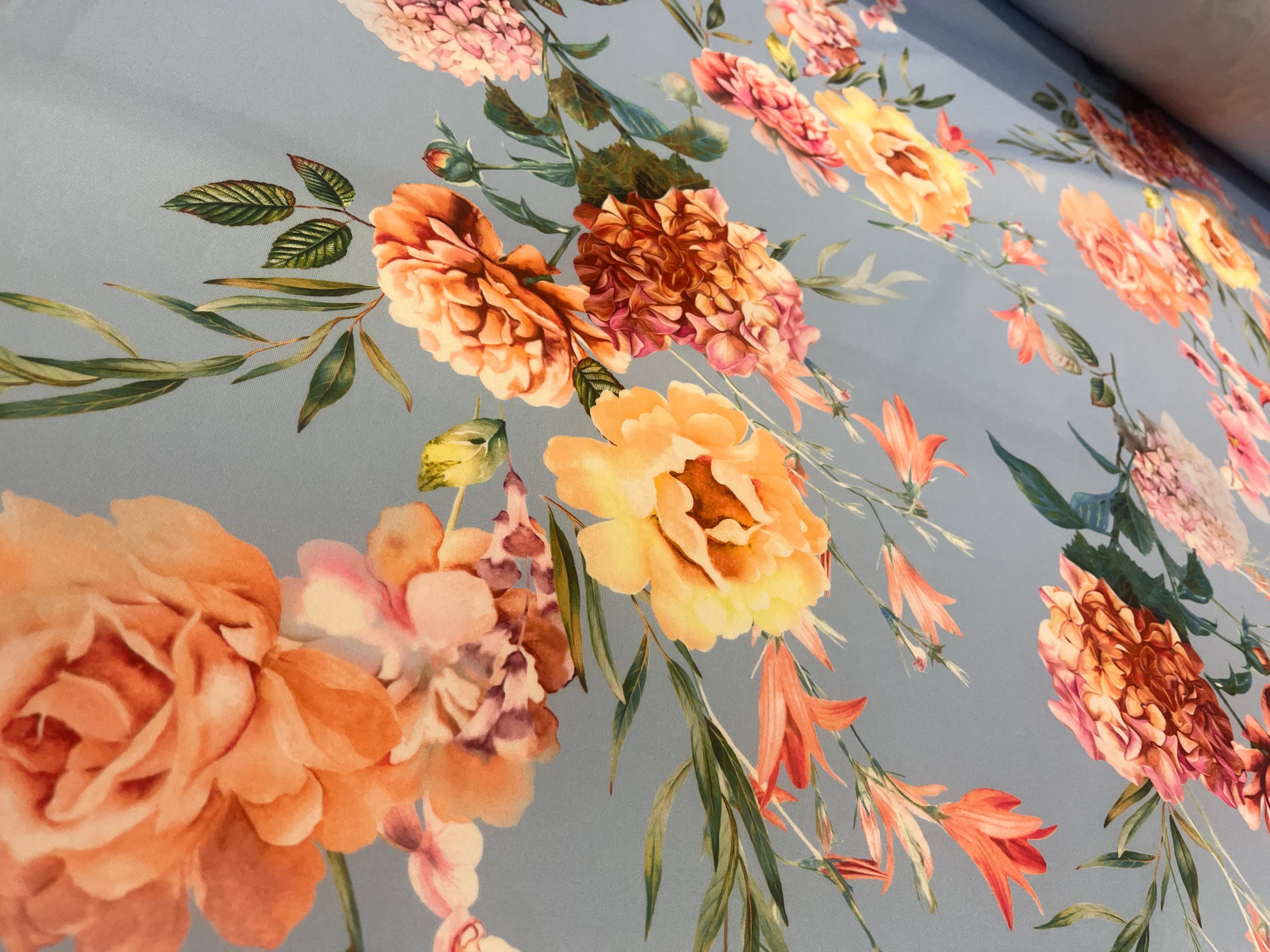 Powder Blue & Peach Garden Rose Floral Scuba Fabric – peach garden roses, yellow peonies and pink orchids on a powder blue ground