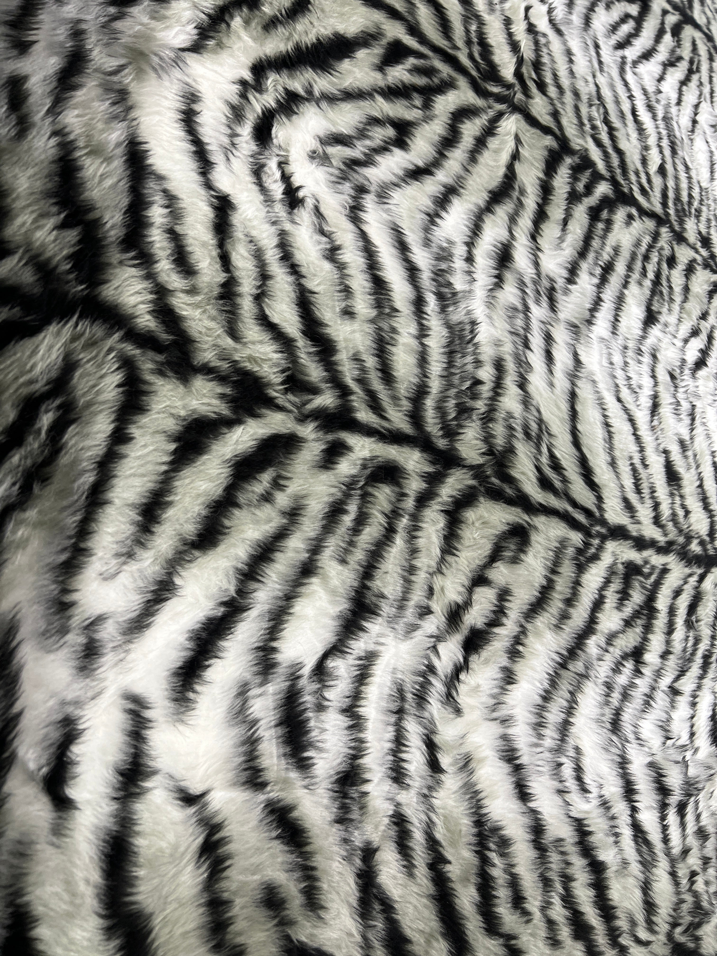 Black & White Snow Tiger Stripe Faux Fur Fabric – snowy white faux fur pile with tapering black tiger stripes