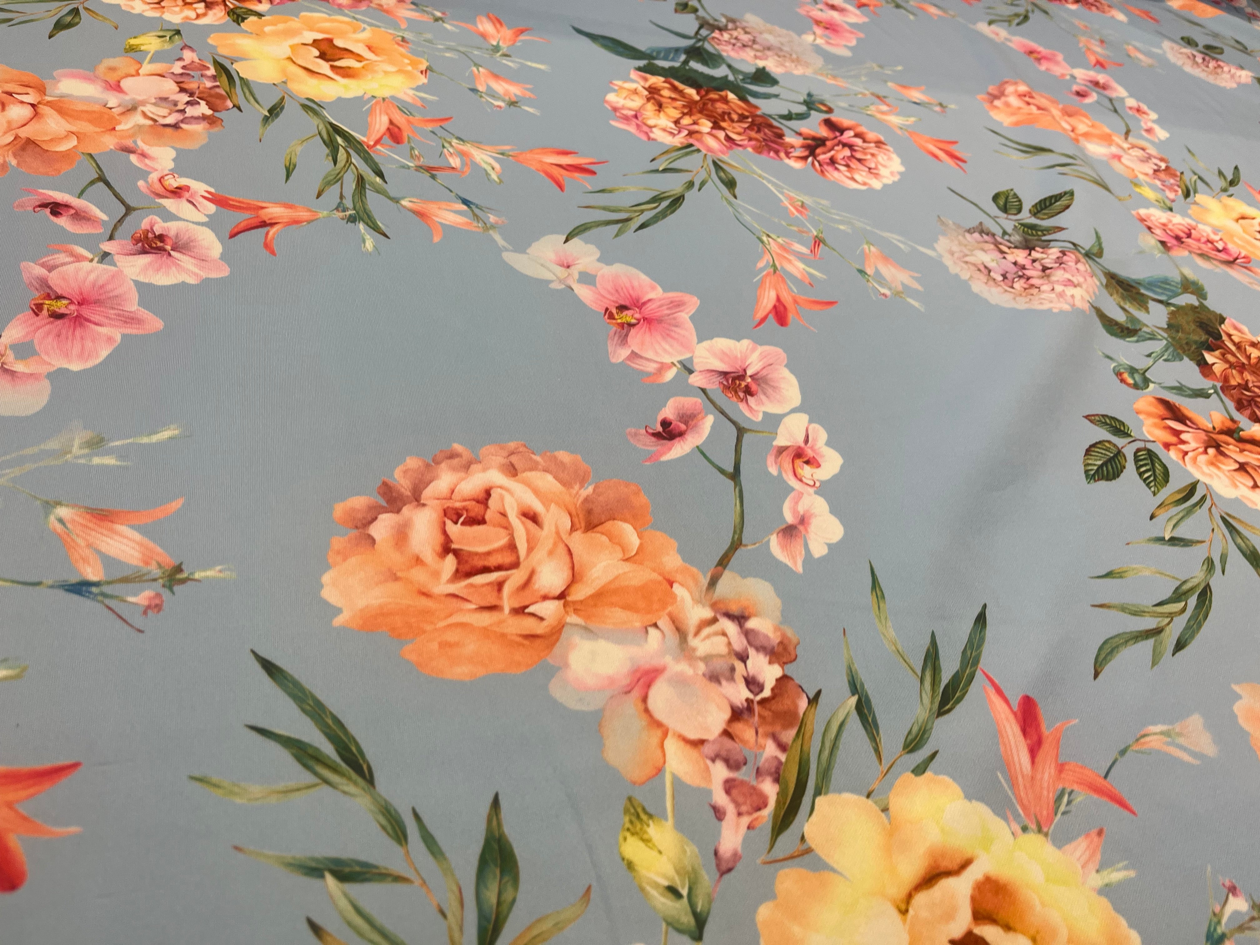 Powder Blue & Peach Garden Rose Floral Scuba Fabric – peach garden roses, yellow peonies and pink orchids on a powder blue ground