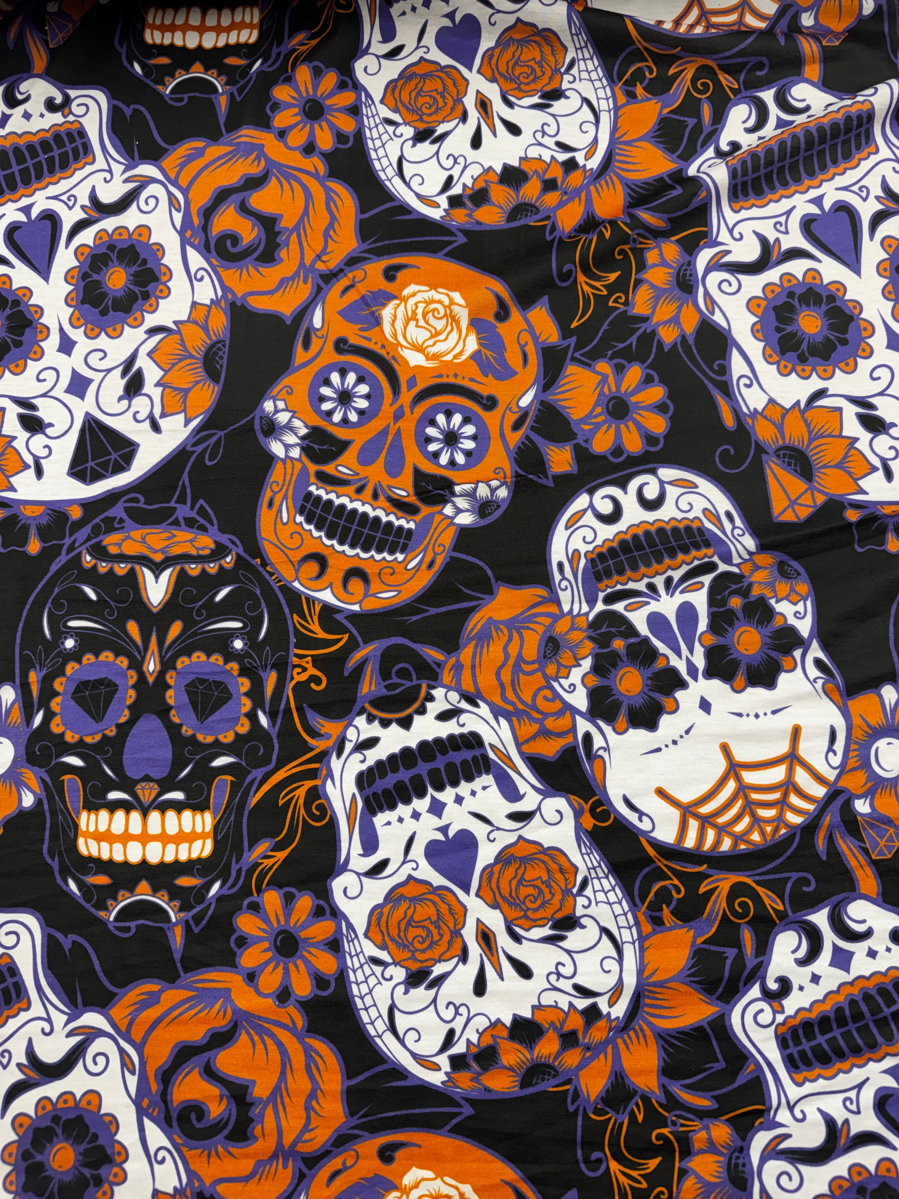 Close-up of colorful sugar skull print on soft jersey fabric