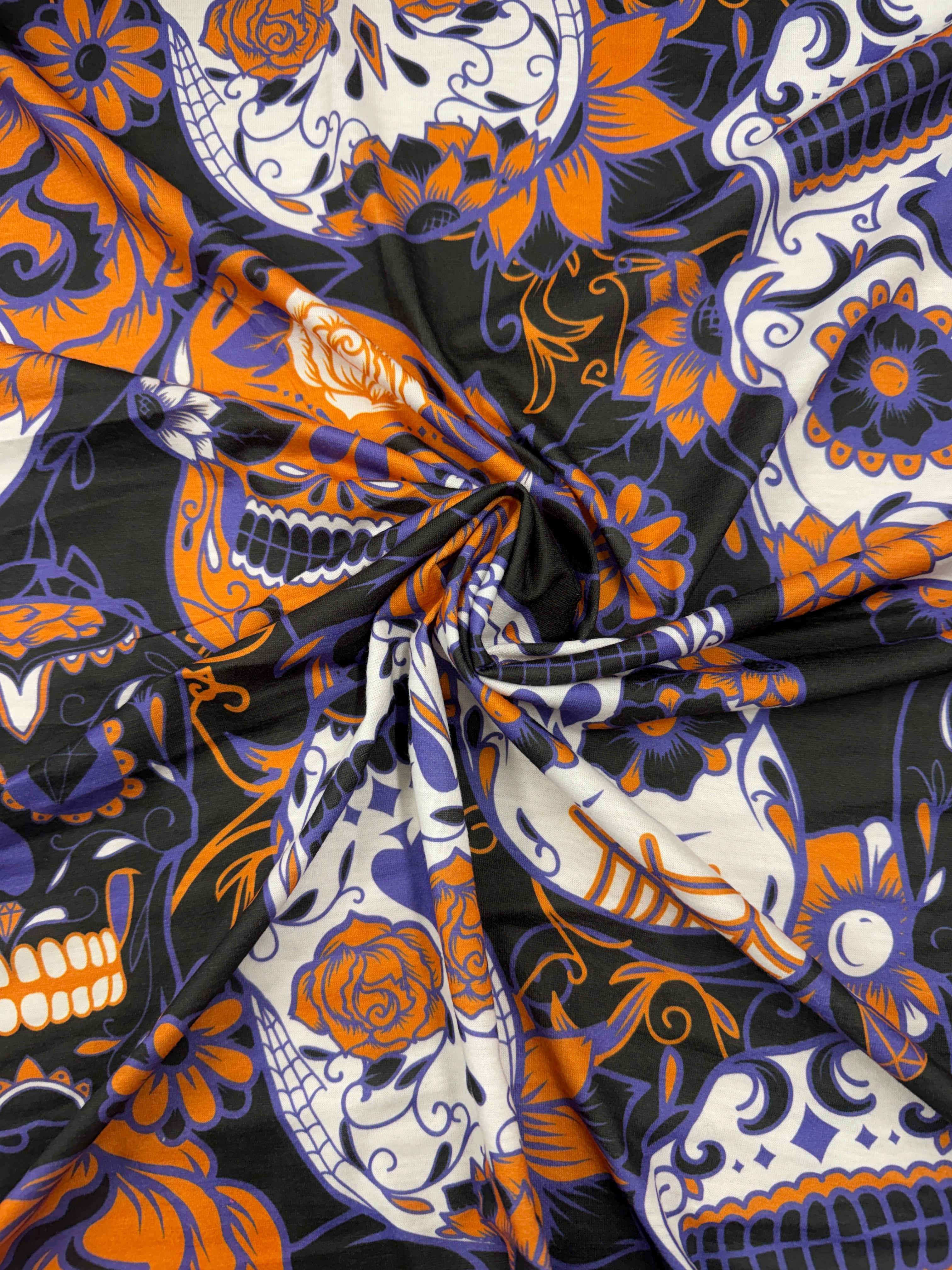 Vibrant sugar skull print fabric with floral designs