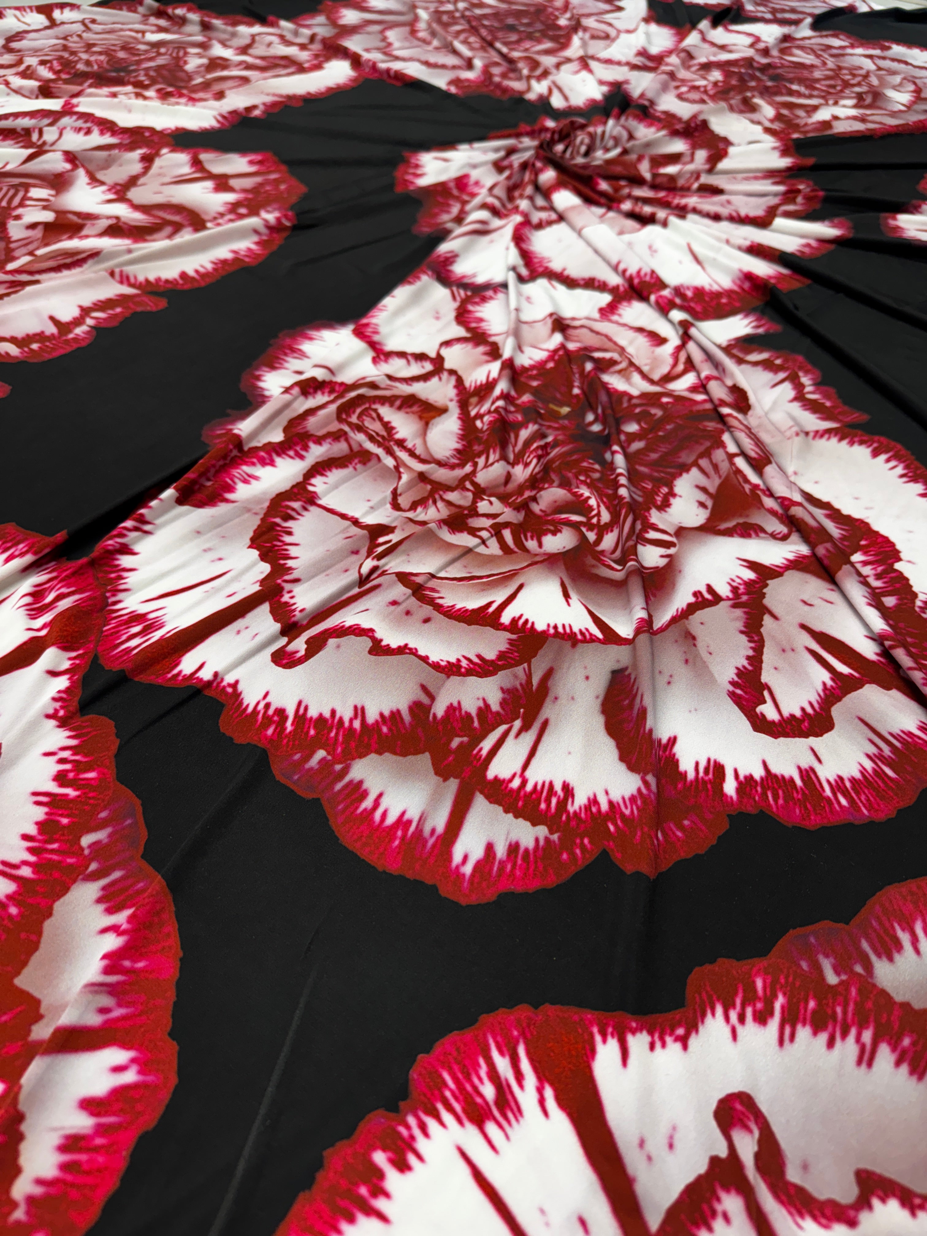 Elegant black and red floral fabric ideal for eveningwear