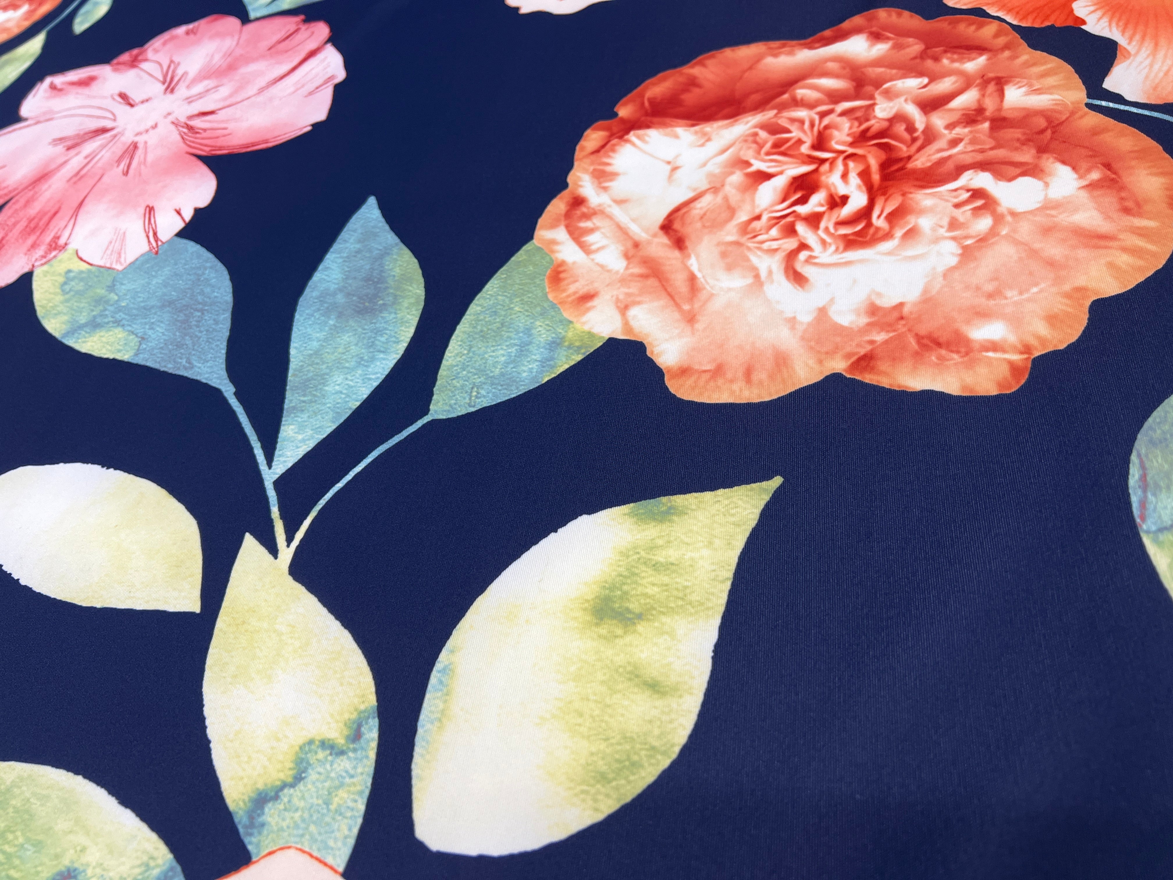 Navy & Coral Watercolour Hibiscus Floral Scuba Fabric – coral hibiscus, peach carnations and pink blossoms on a navy ground