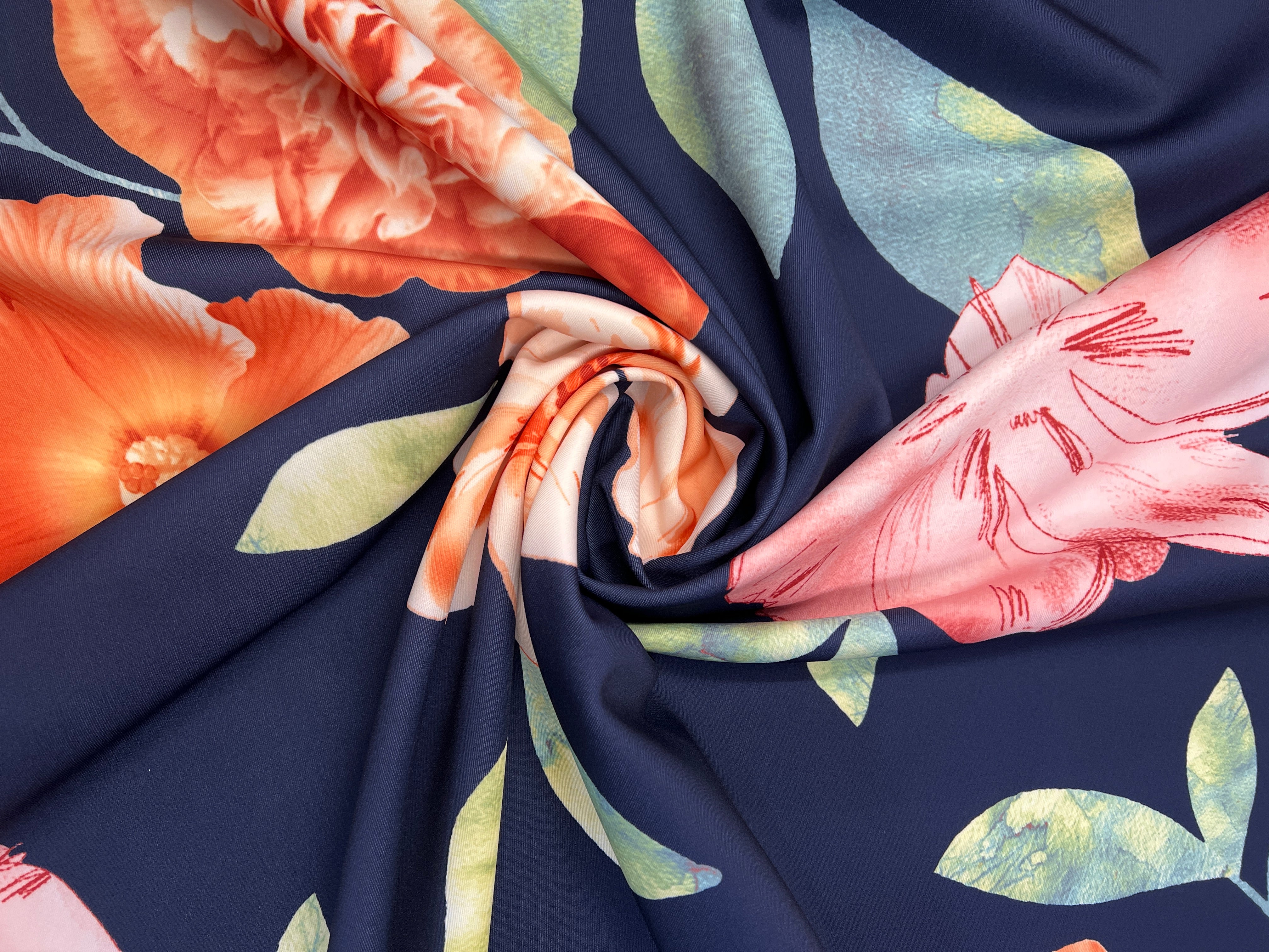 Navy & Coral Watercolour Hibiscus Floral Scuba Fabric – coral hibiscus, peach carnations and pink blossoms on a navy ground