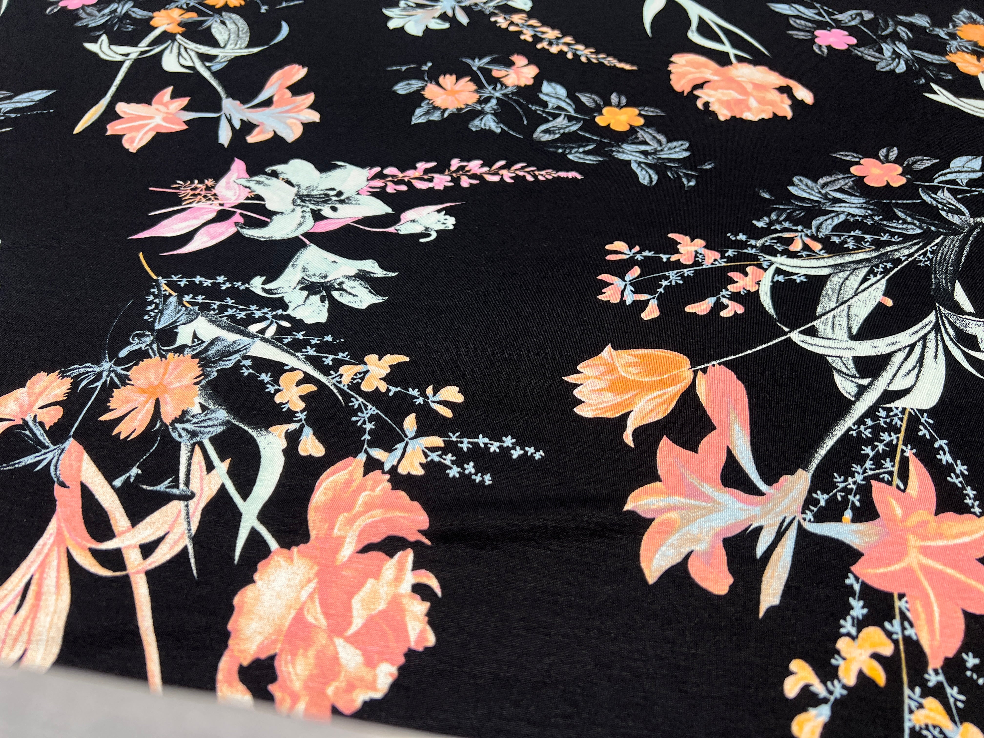 Dressmaking & Jersey Fabric – Black Floral Stretch Knit with Peach & Pink Blossoms – 173cm