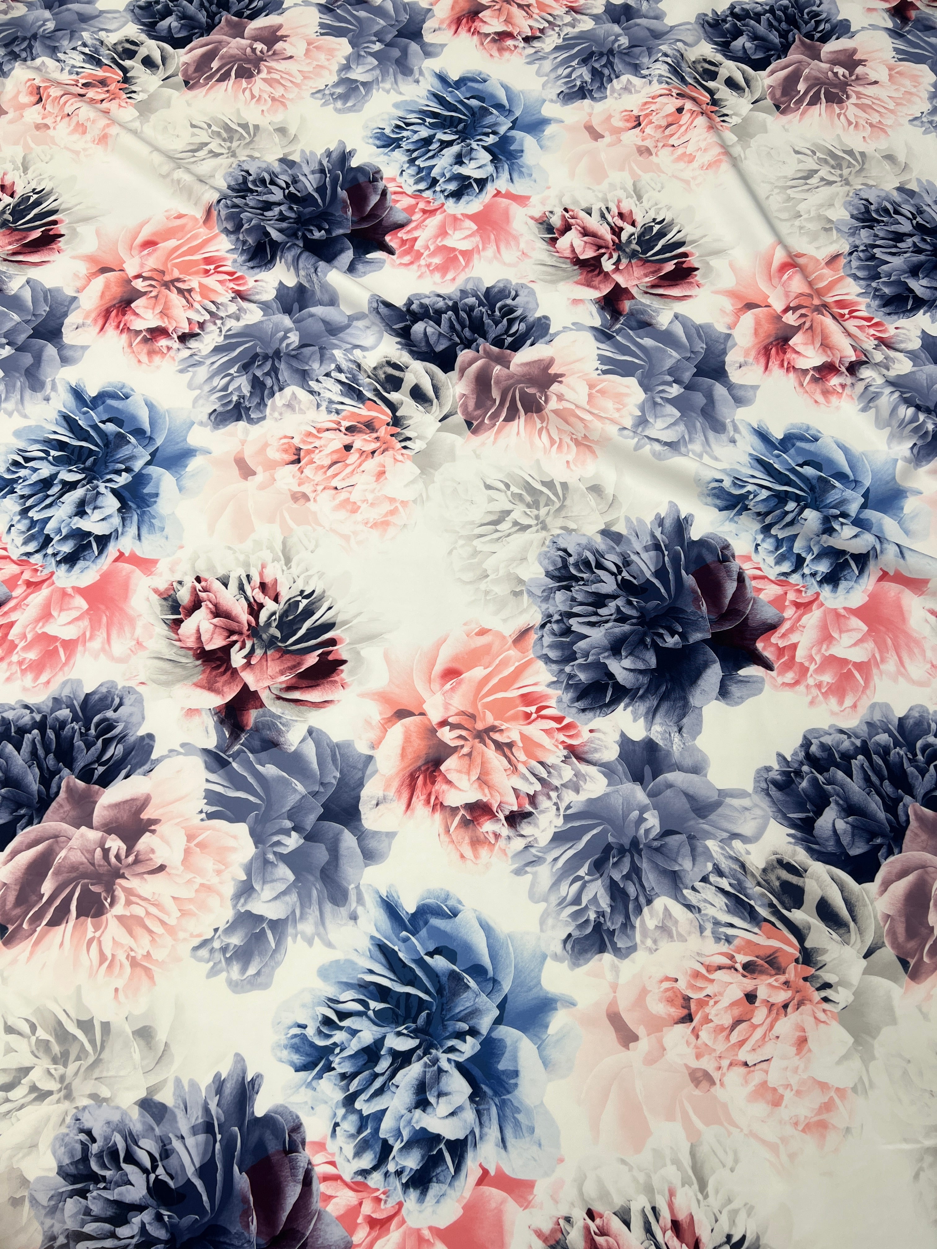 Floral pattern with pink and blue flowers on a light background