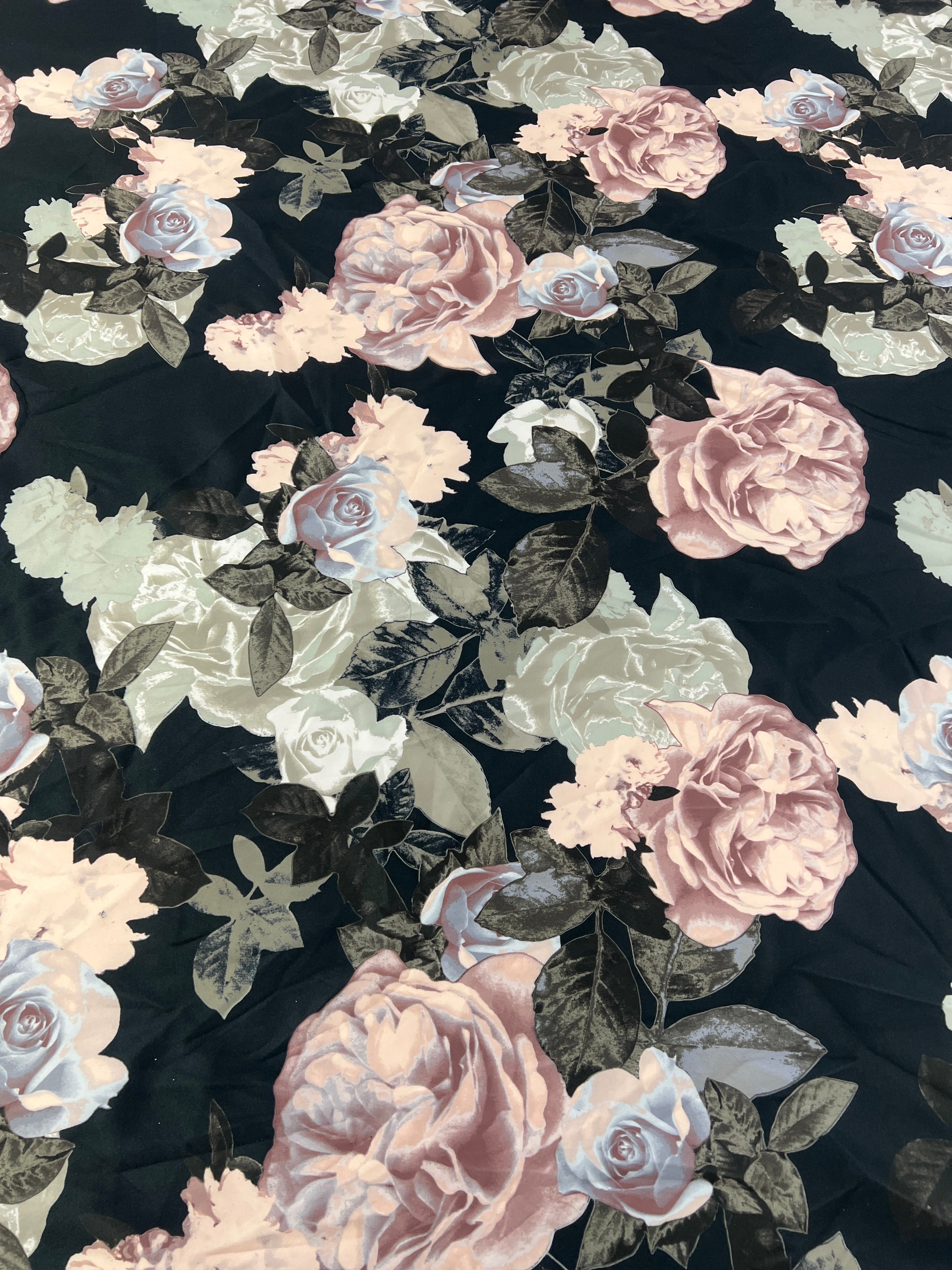 Draped Black Rose Floral Scuba Fabric showcasing its texture