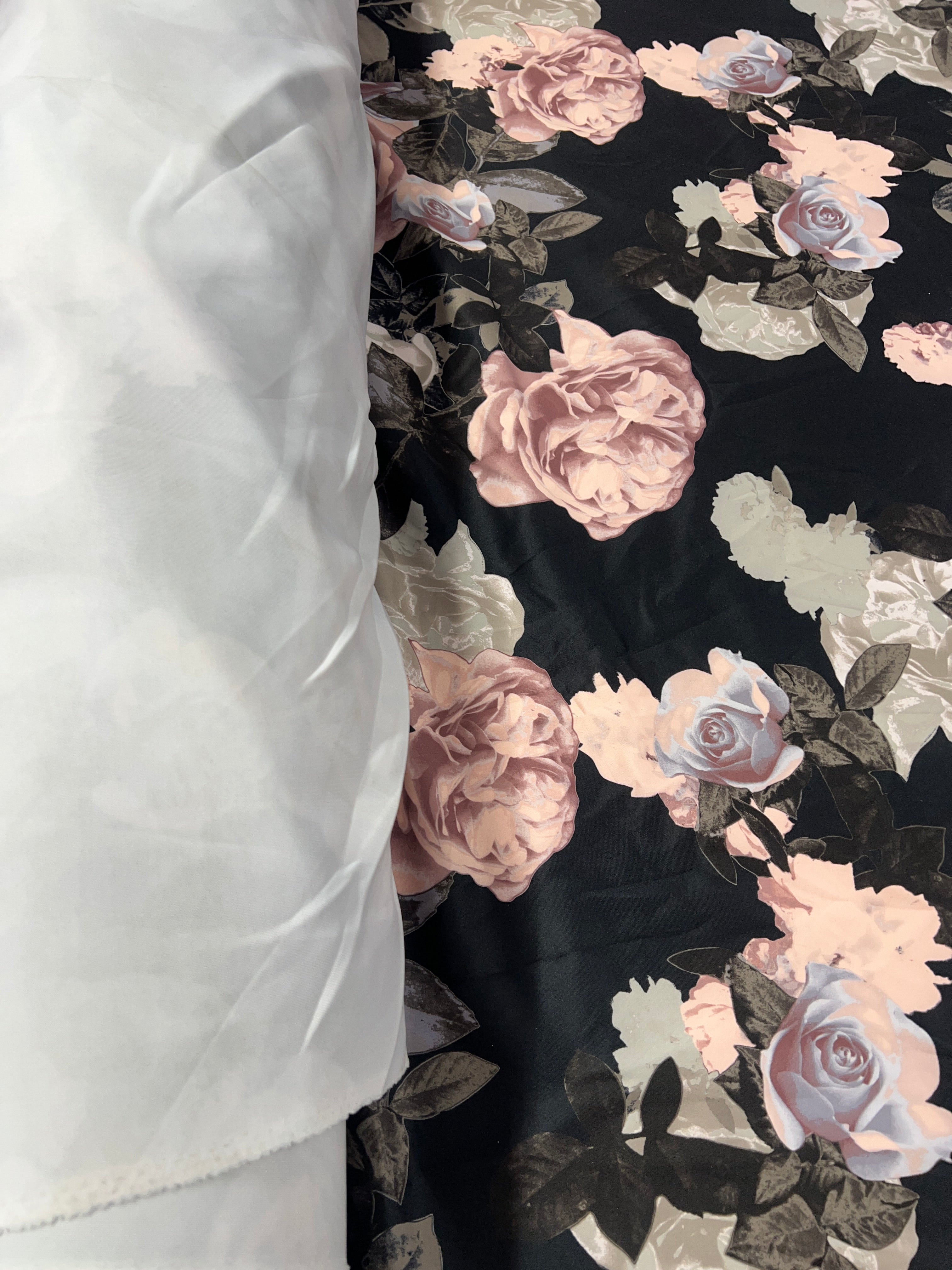 Close-up of Black Rose Floral Pattern on Scuba Fabric