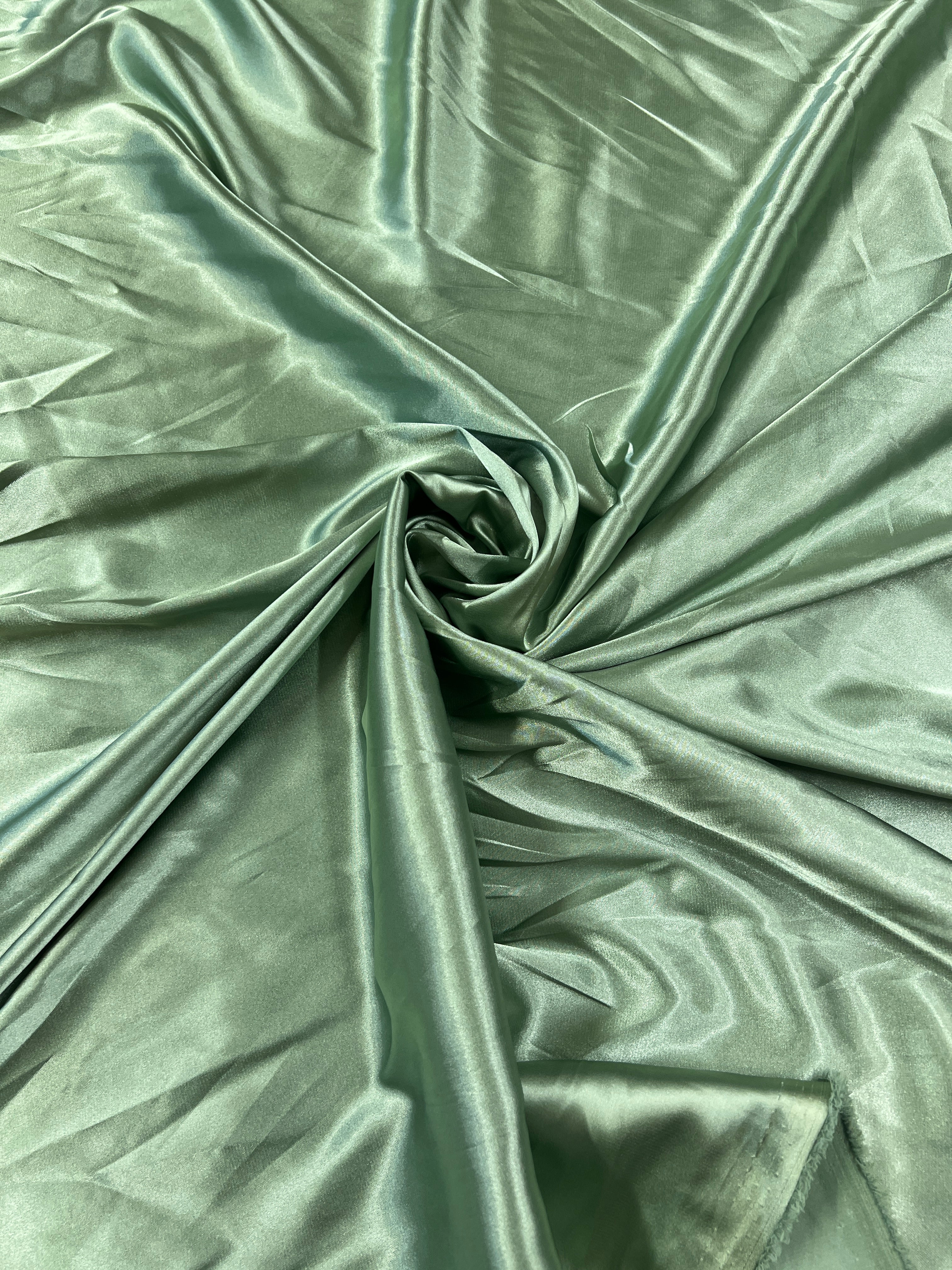 Close-up of green fabric with folds