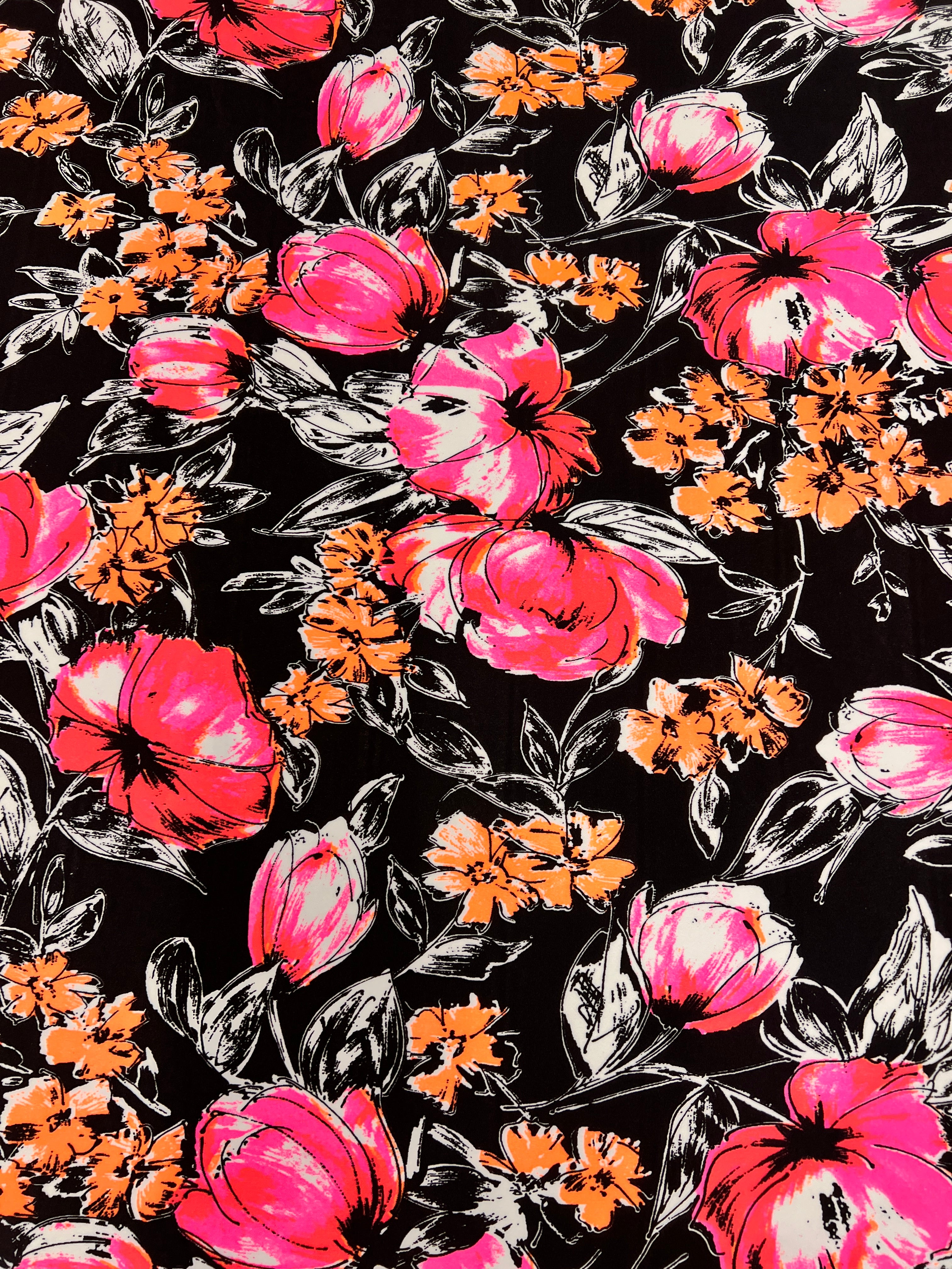 Floral pattern with pink, orange, and black flowers on a black background