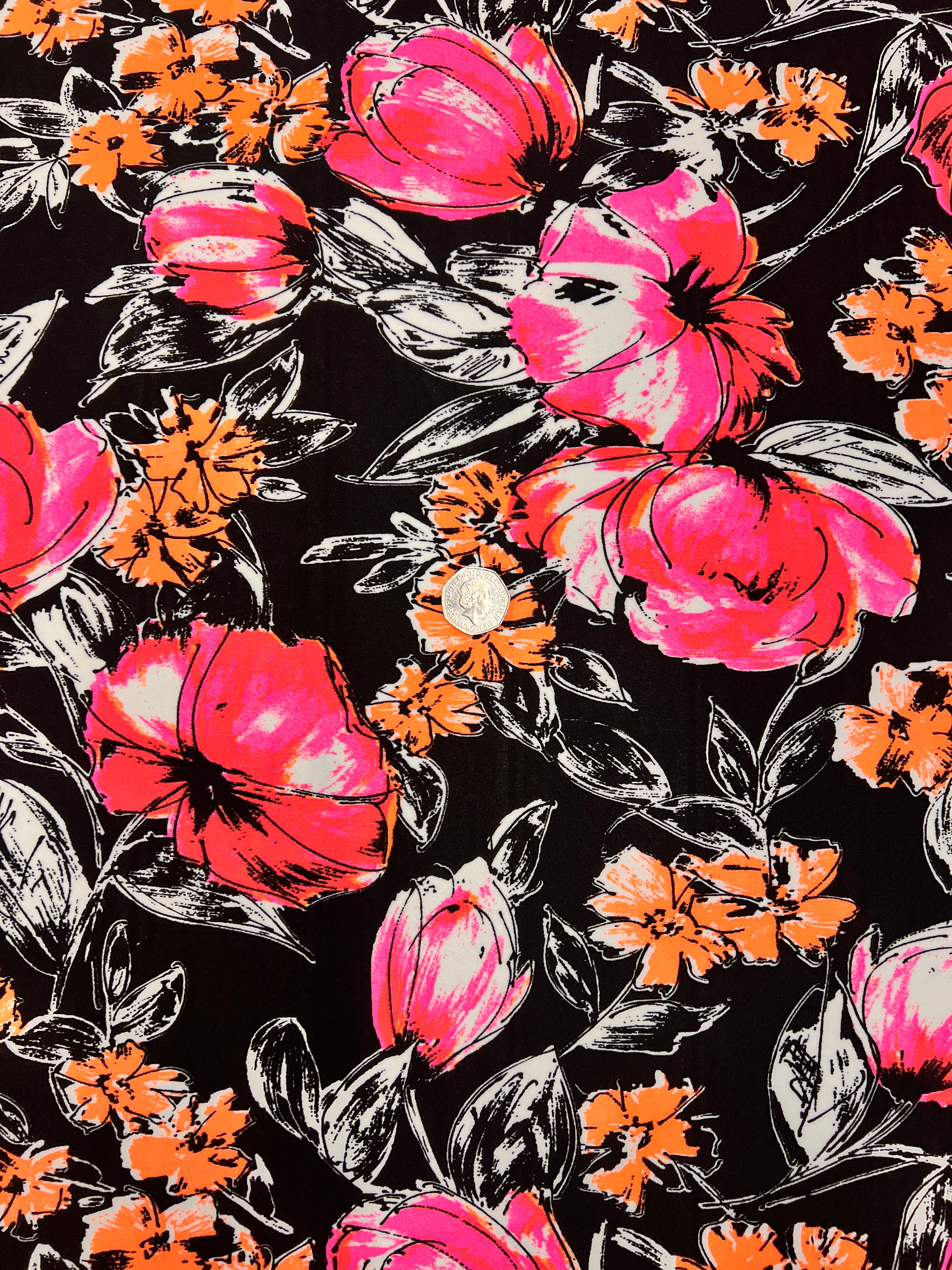 Floral pattern with pink and orange flowers on a black background
