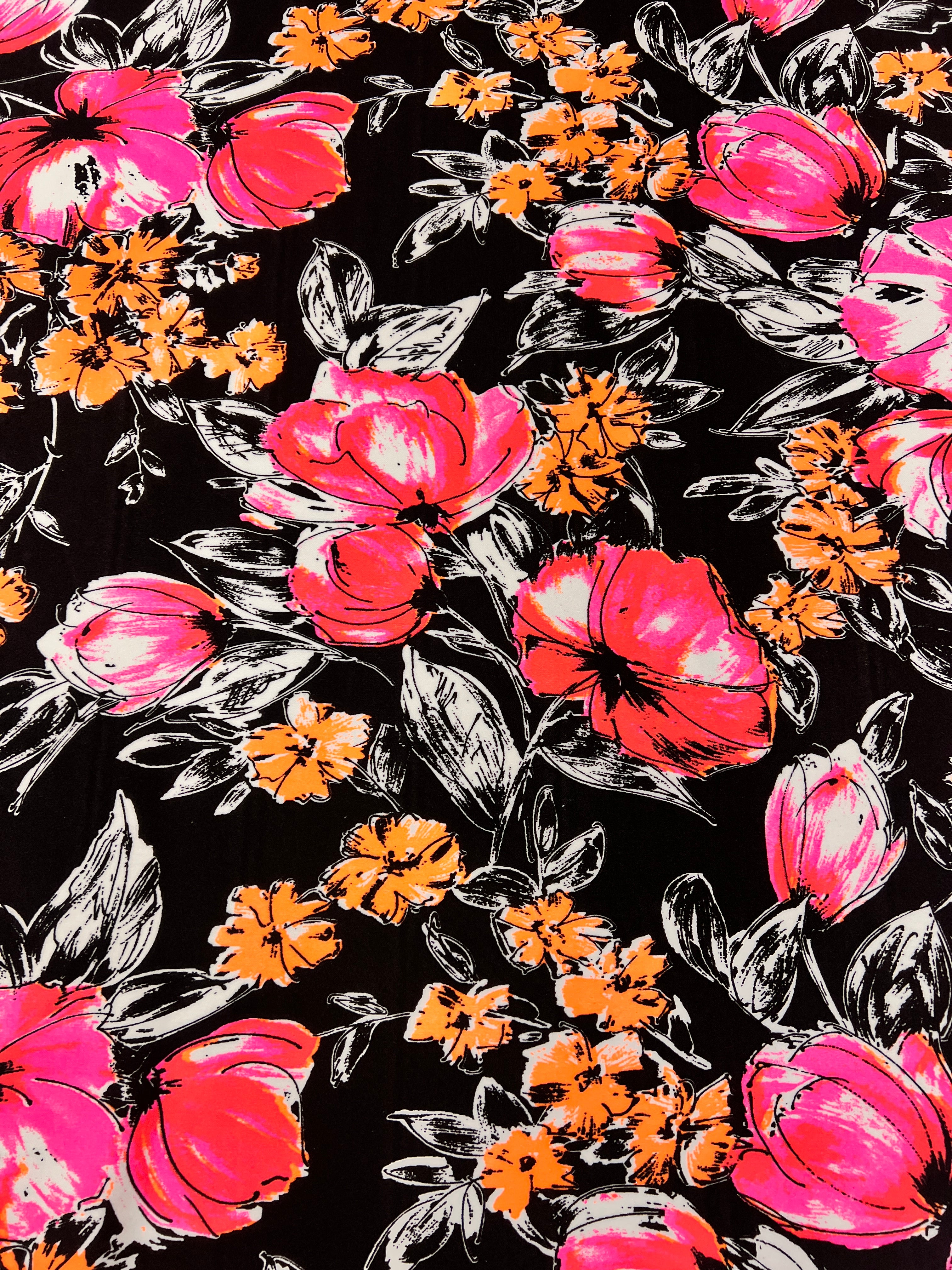 Floral pattern with pink and orange flowers on a black background