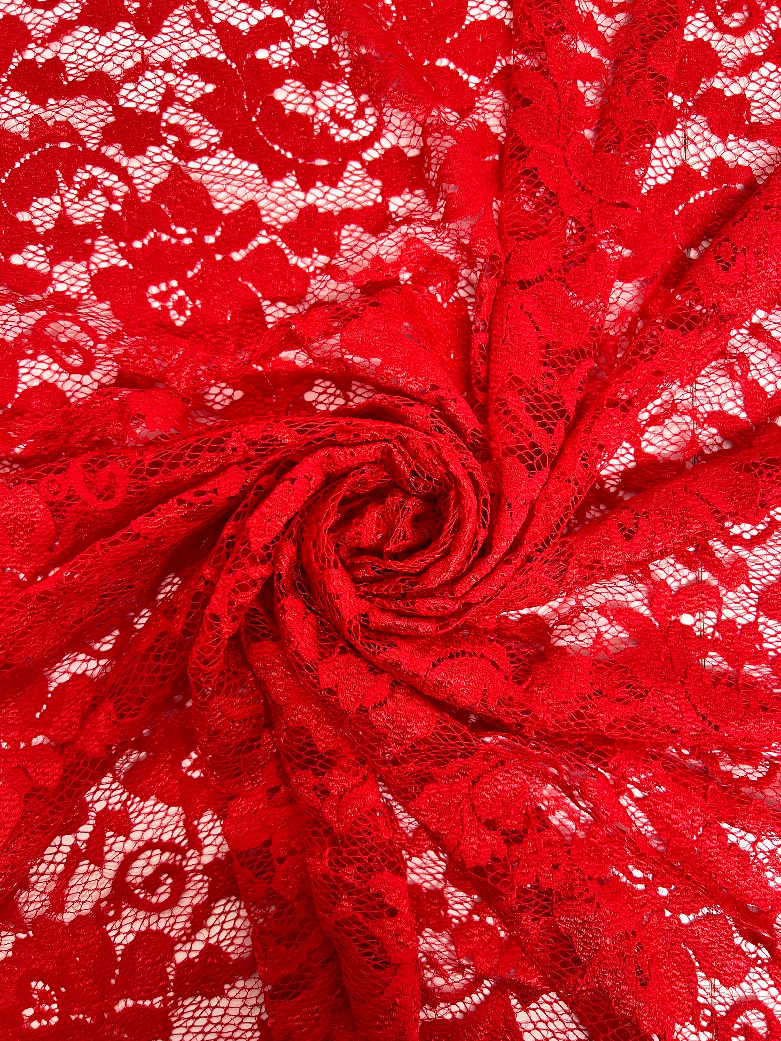 Red lace fabric with intricate patterns