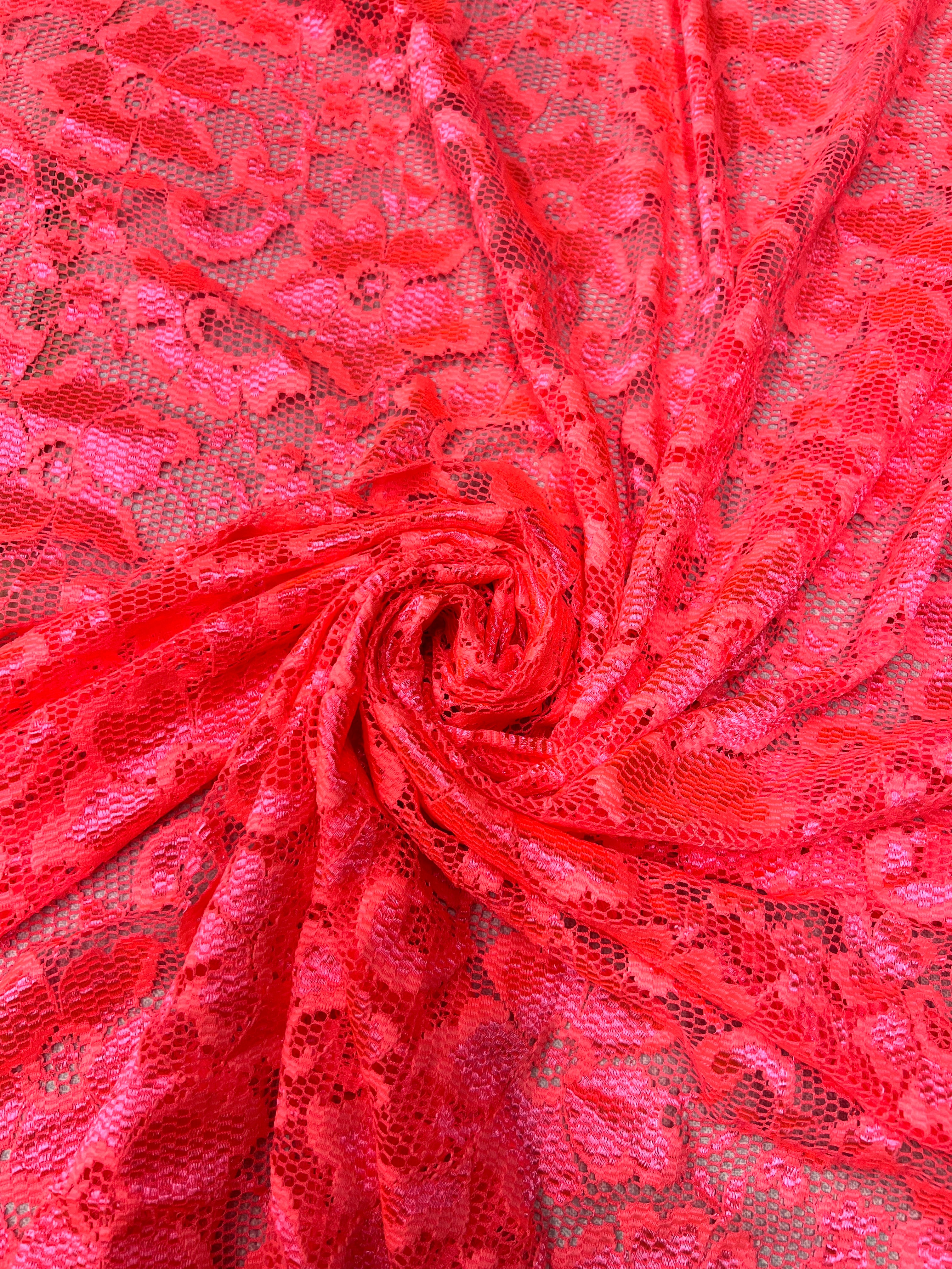 Close-up of red lace fabric with intricate patterns