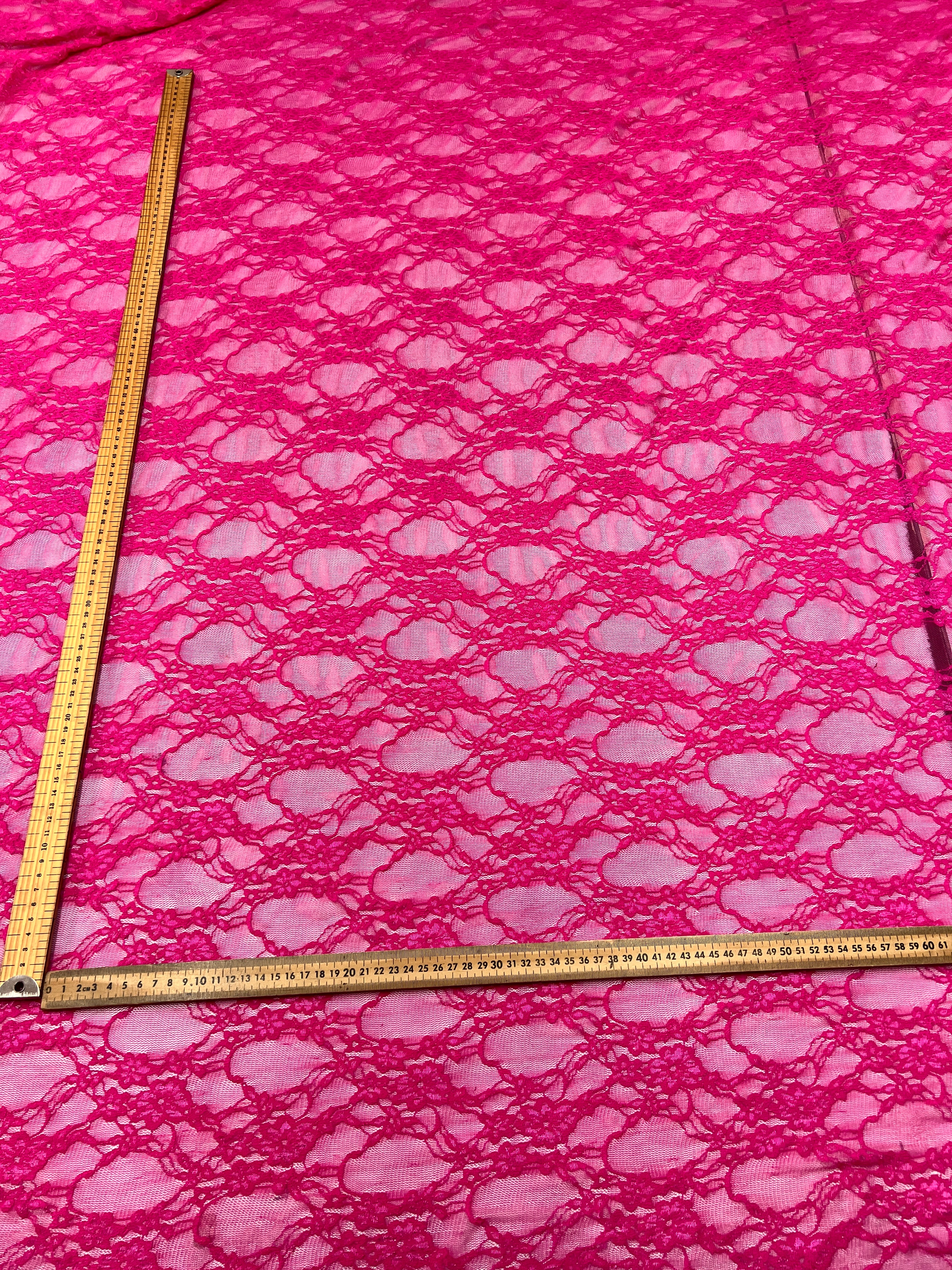 Close-up of pink textured fabric with a ruler for scale