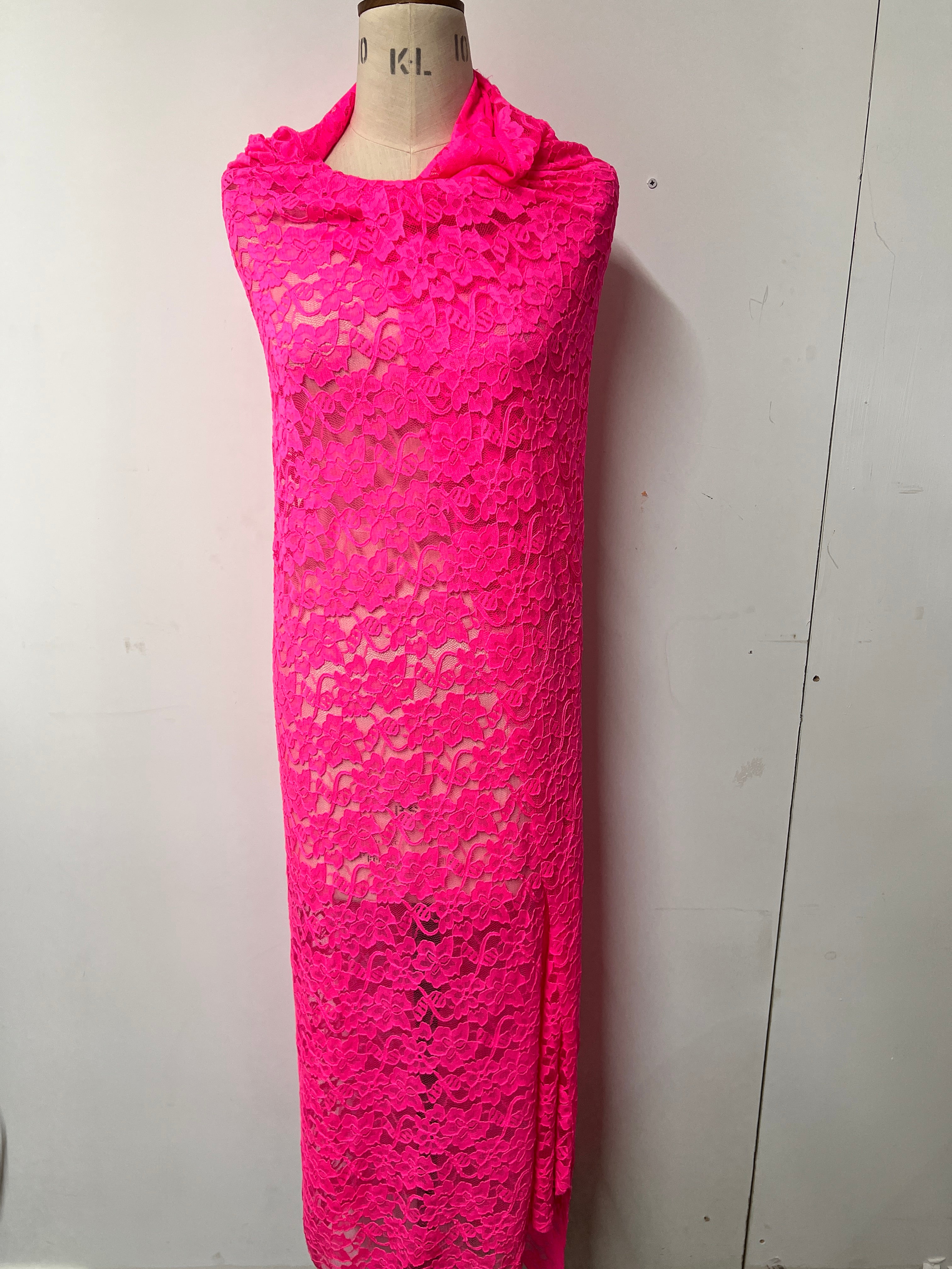 Pink lace garment on a white background