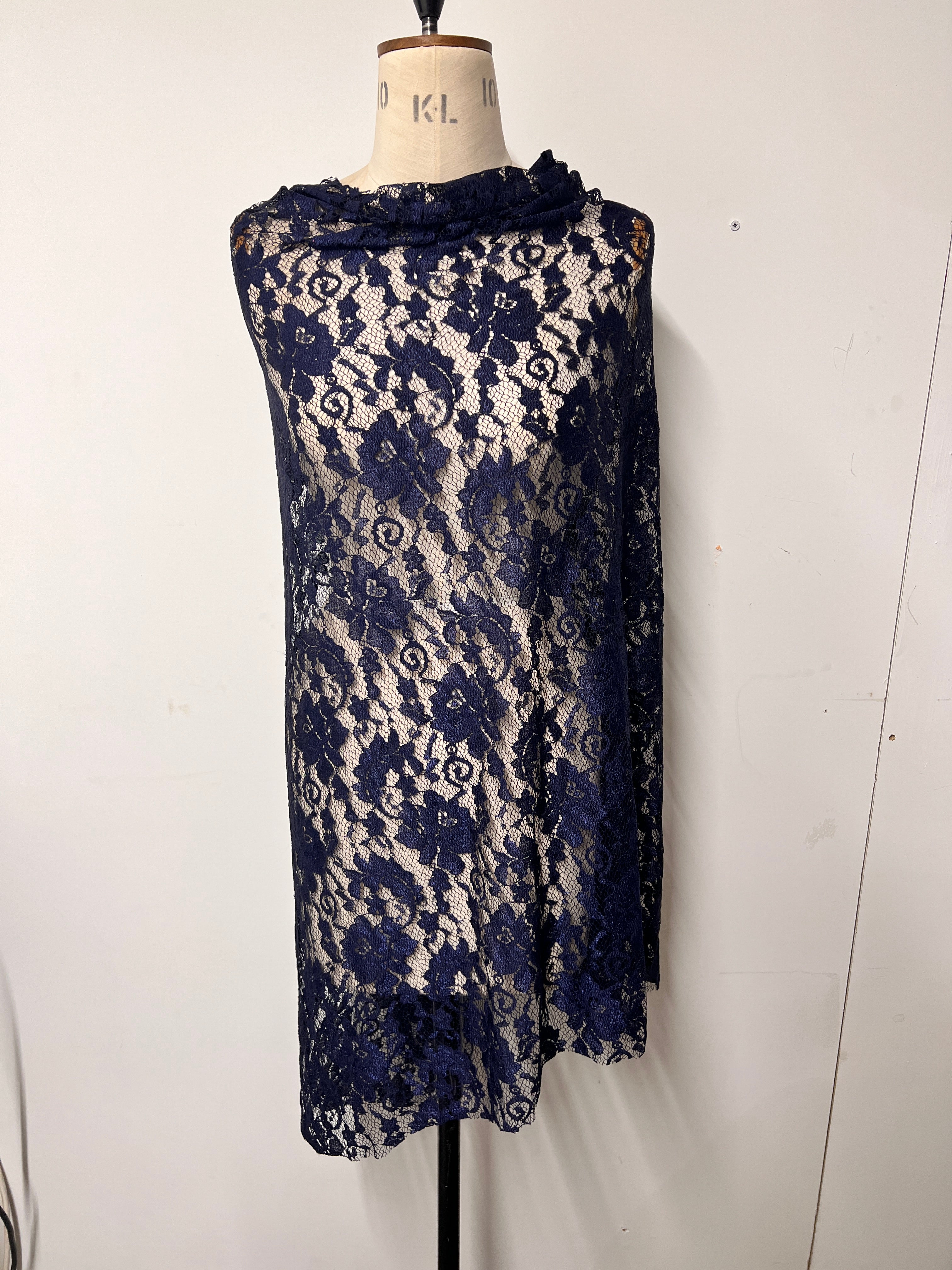 Folded blue floral patterned fabric on a white background