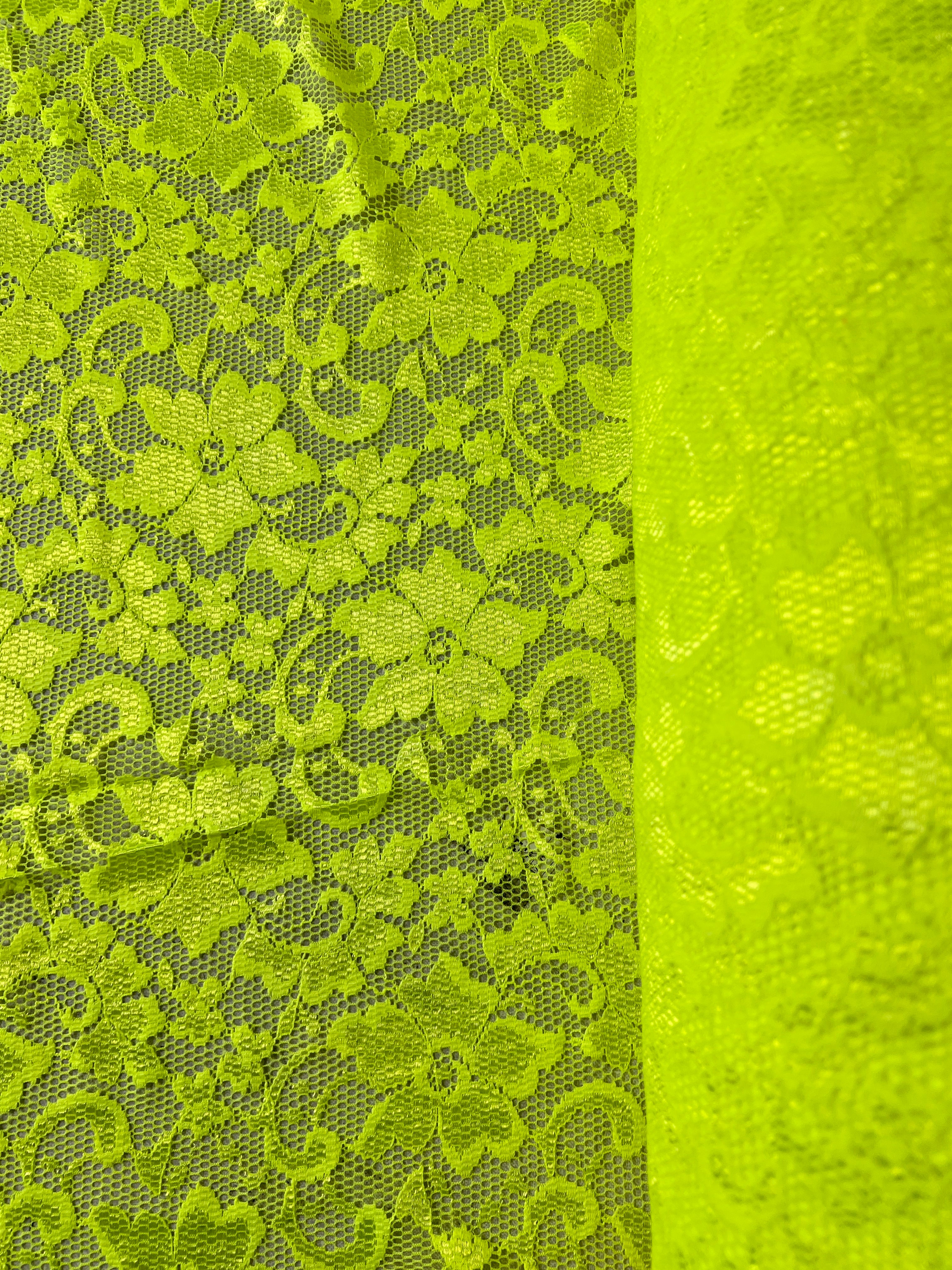 Green lace fabric with floral patterns