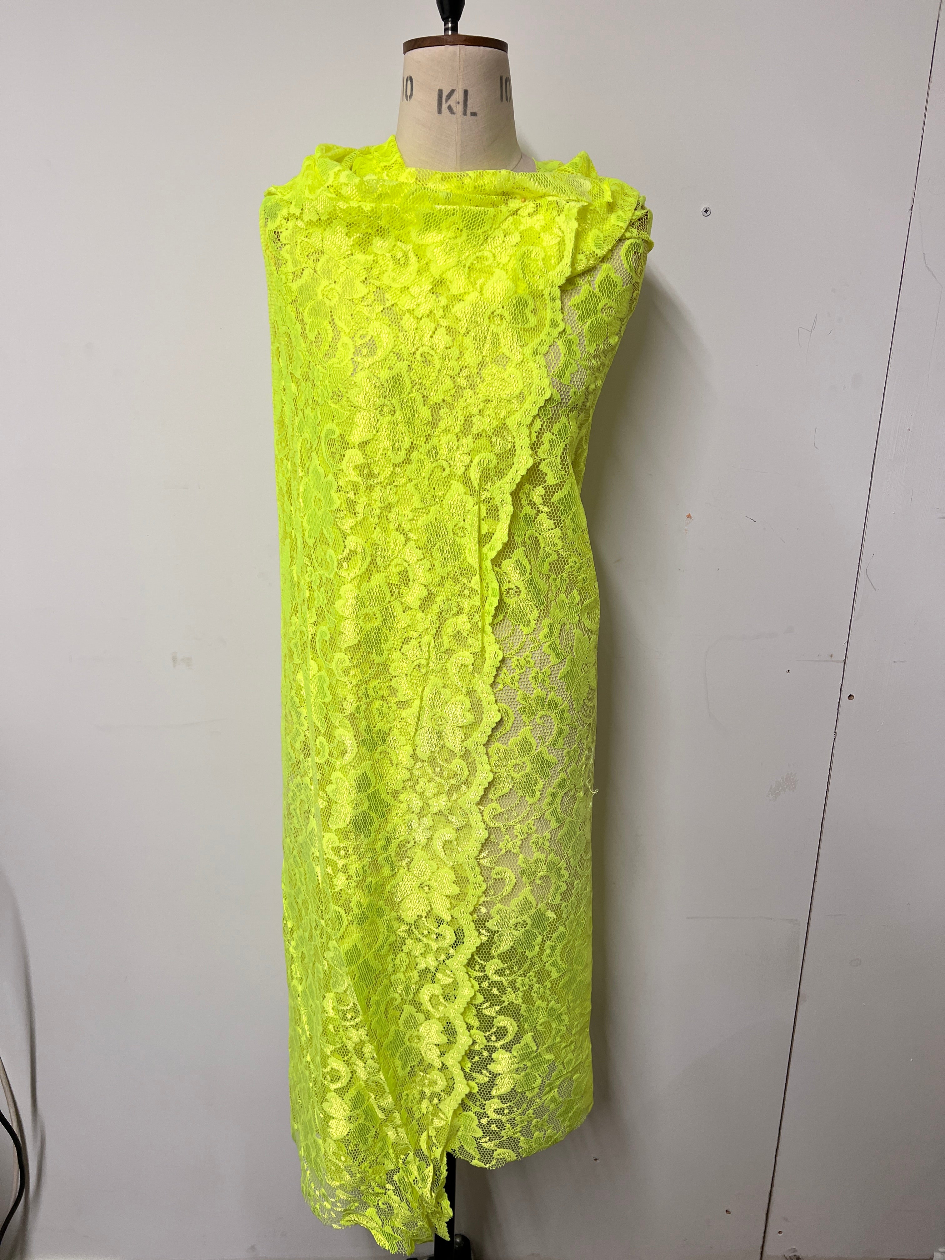 Yellow lace fabric on a white background