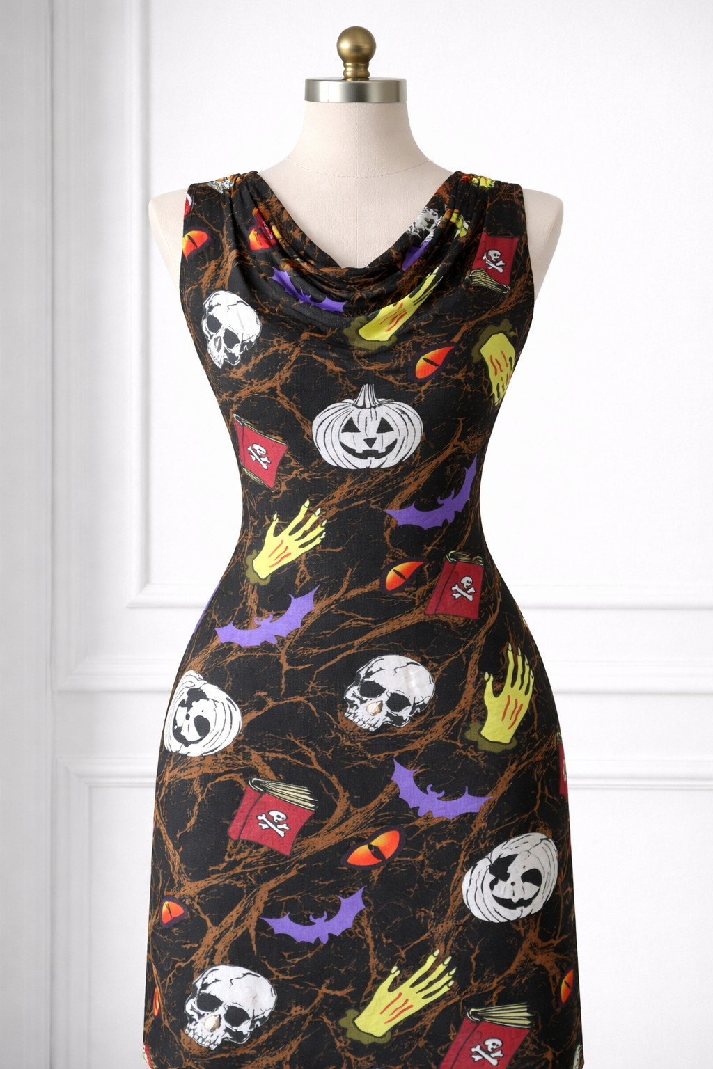 Halloween-themed dress on a mannequin against a white background