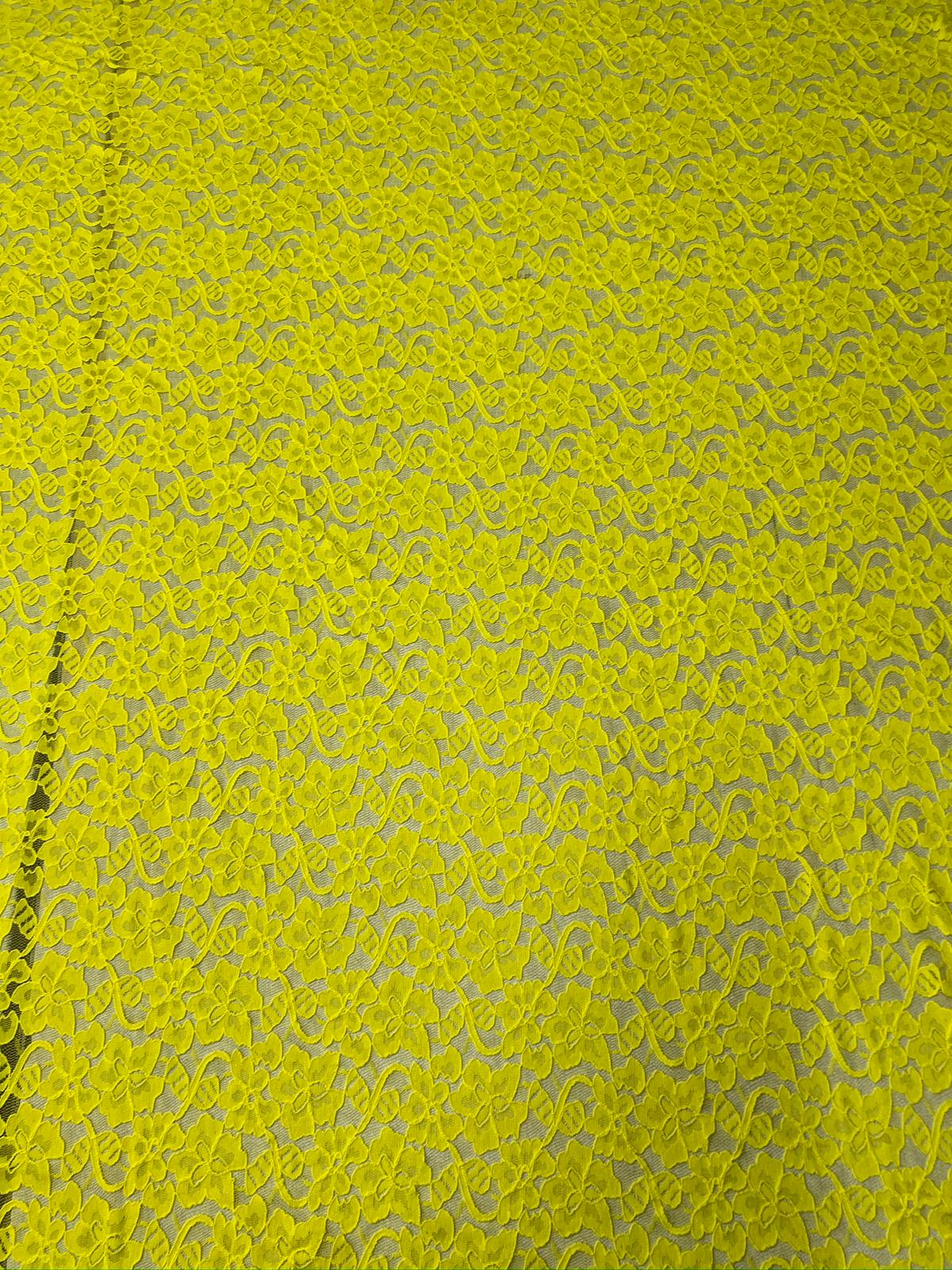 Yellow lace fabric with intricate patterns
