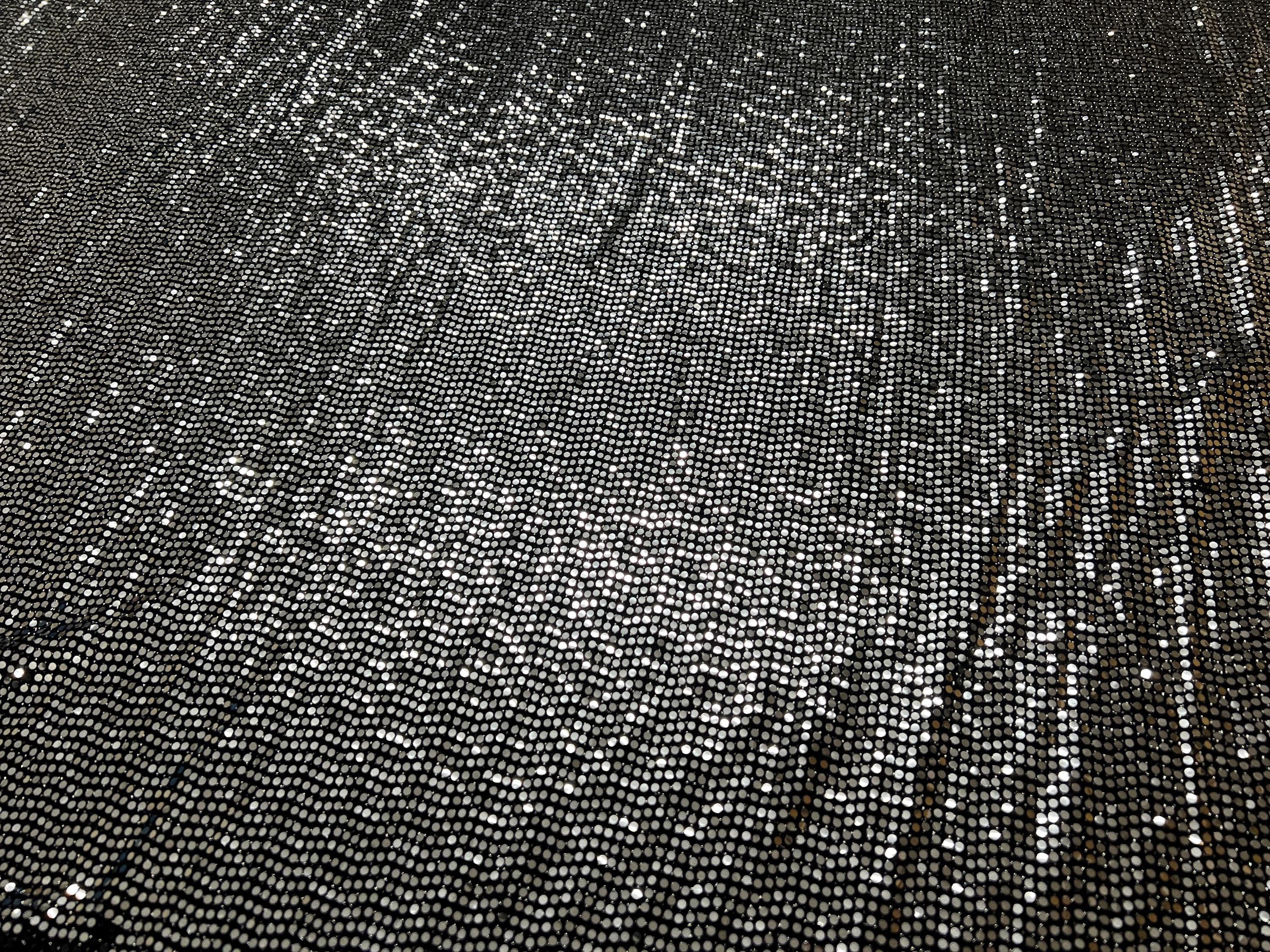 Reflective sequin-like shine of stretch fabric