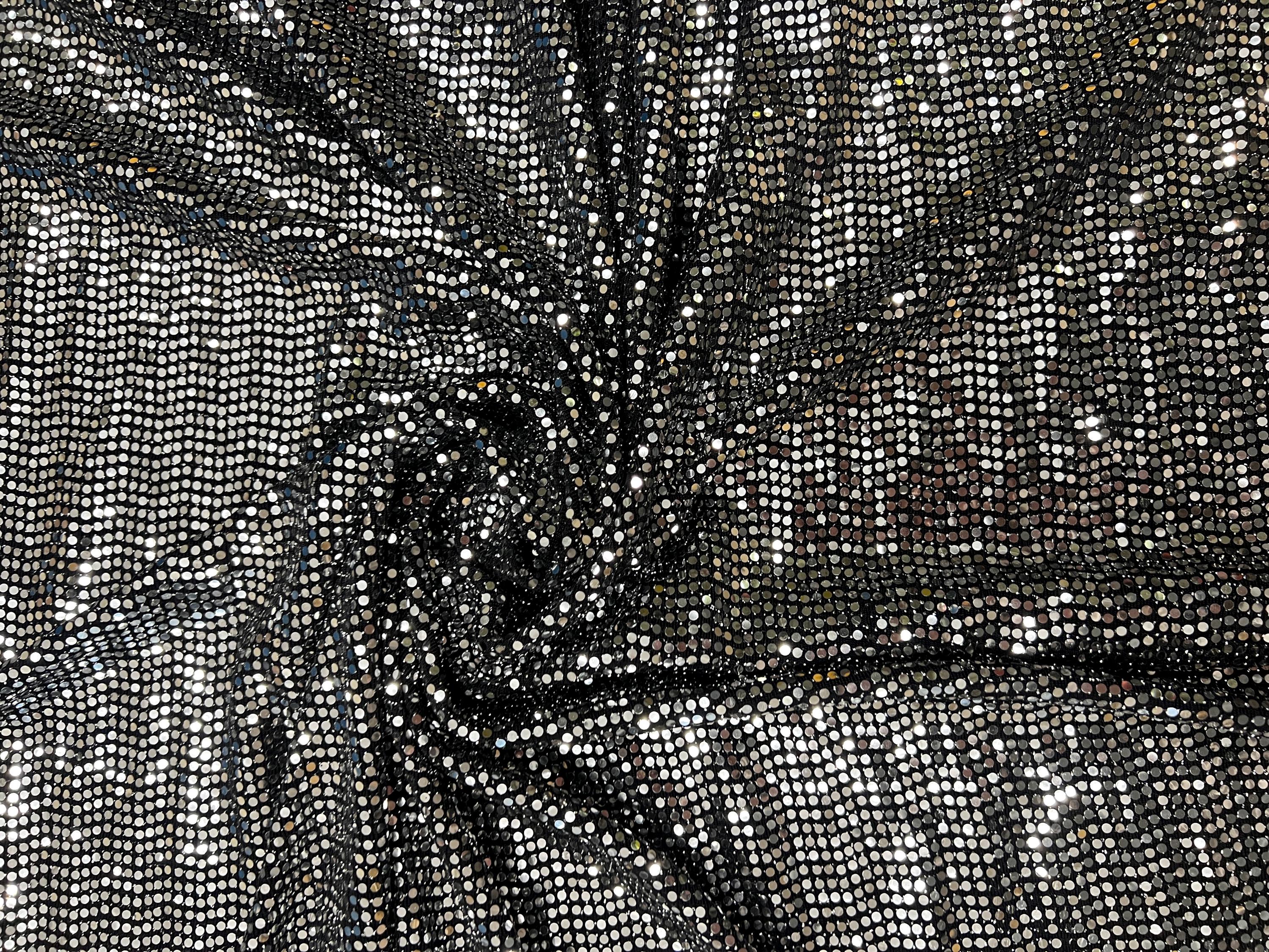 Close-up of black silver foil dot stretch fabric