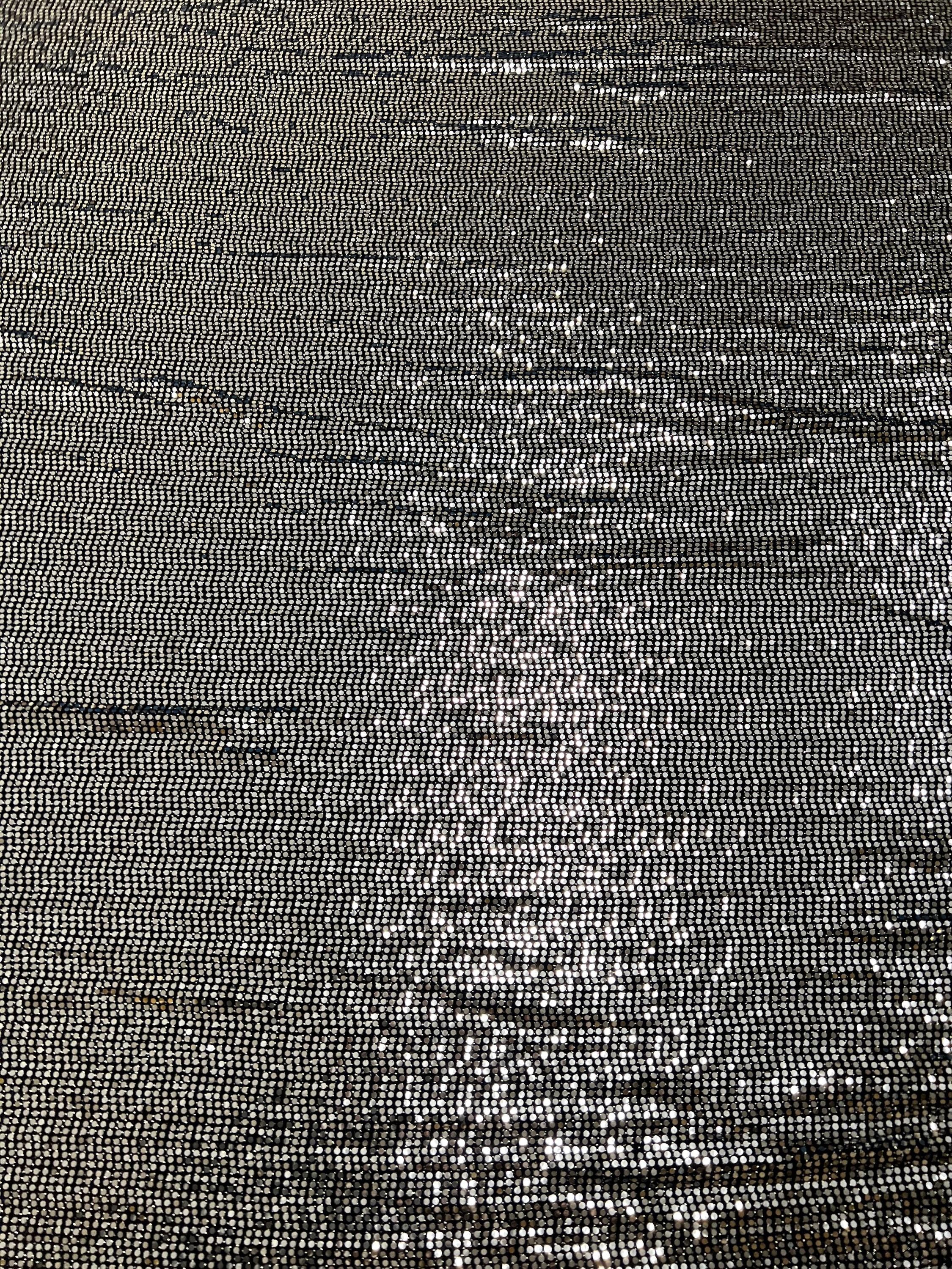 Smooth texture of black metallic foil dot fabric