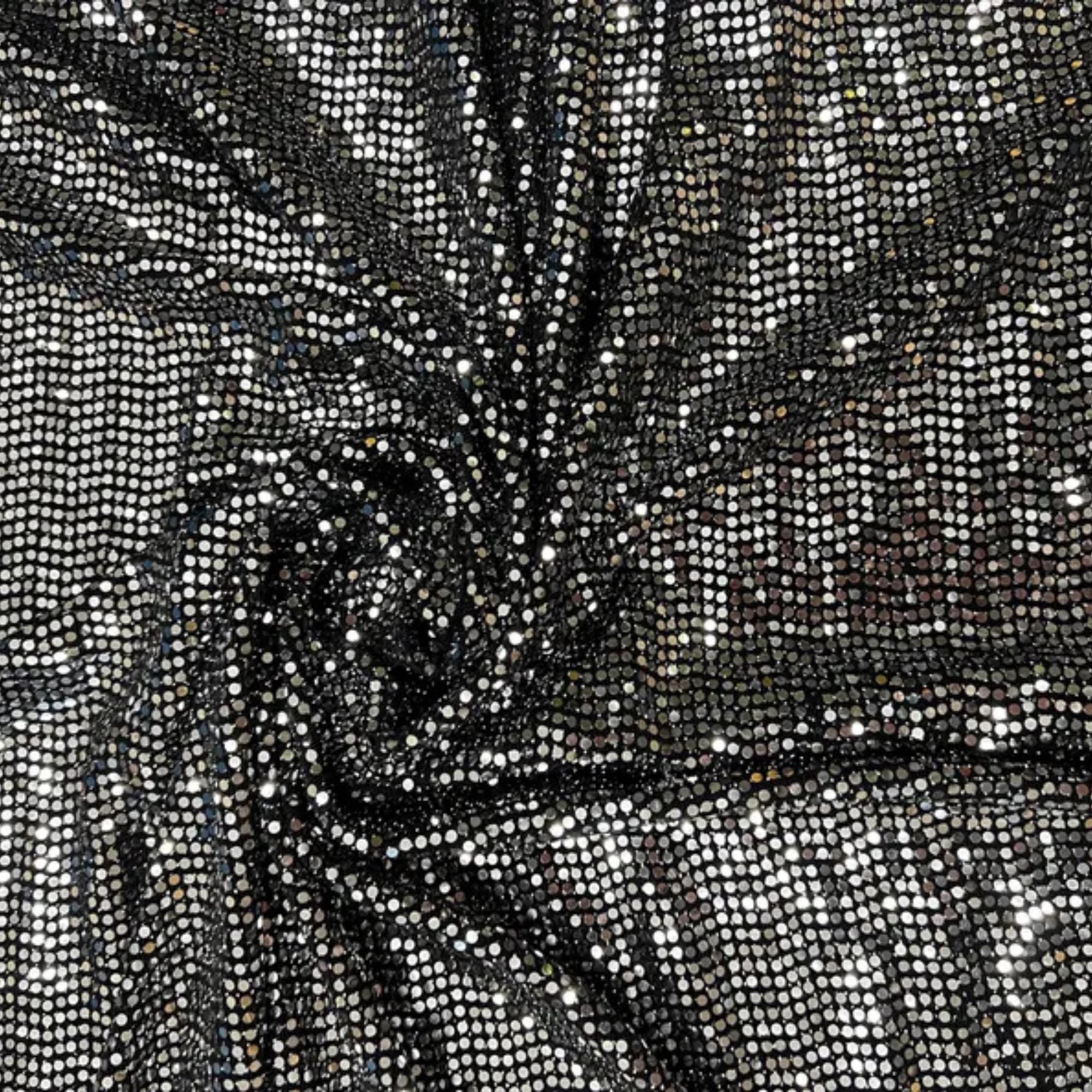 Draped black silver foil dot fabric for creative projects