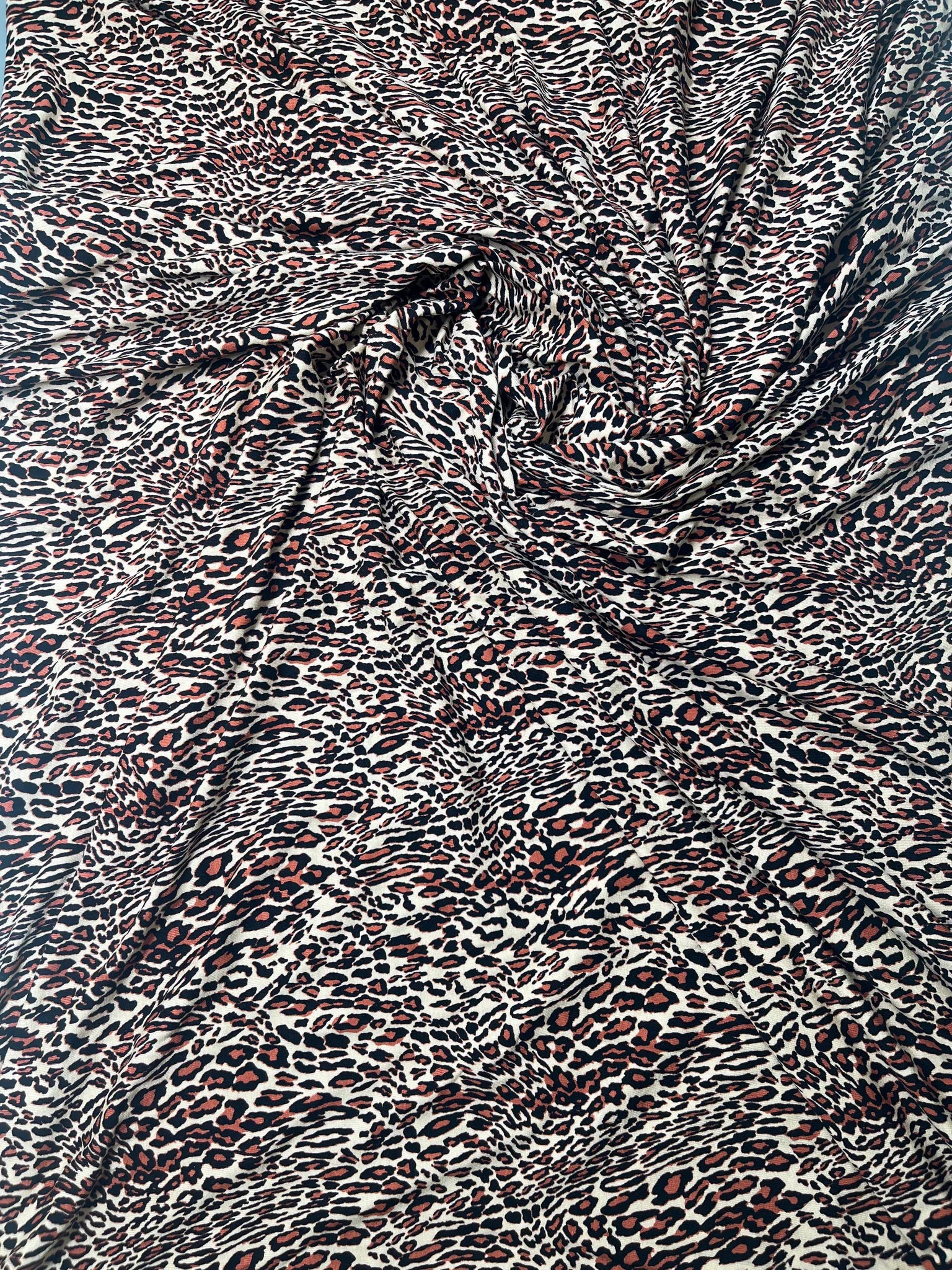 Close-up of soft spun polyester jersey fabric texture.