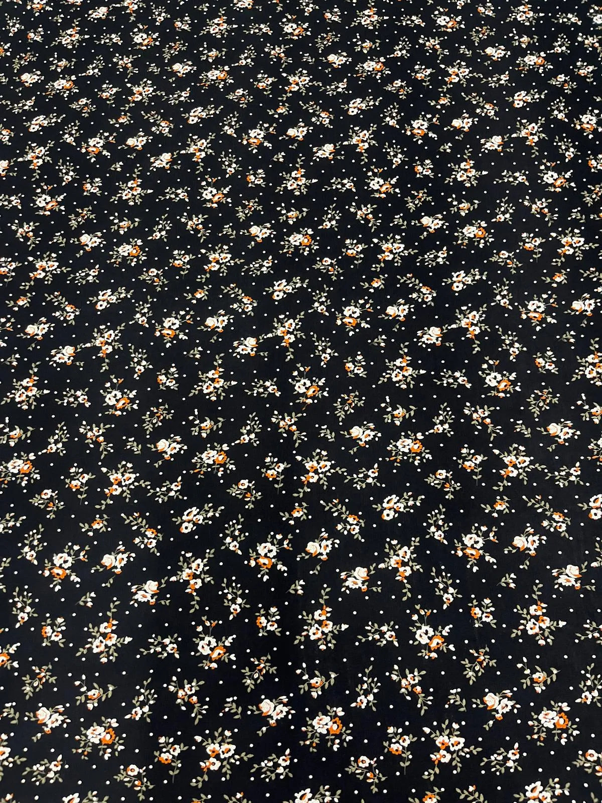 Fluid drape of black floral viscose elastane fabric