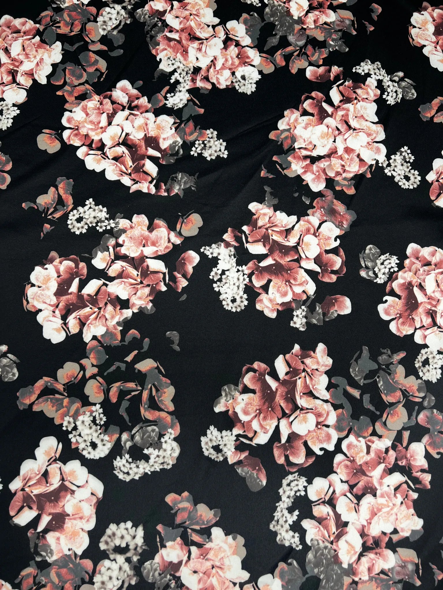 Beautiful black stretch knit fabric with floral print