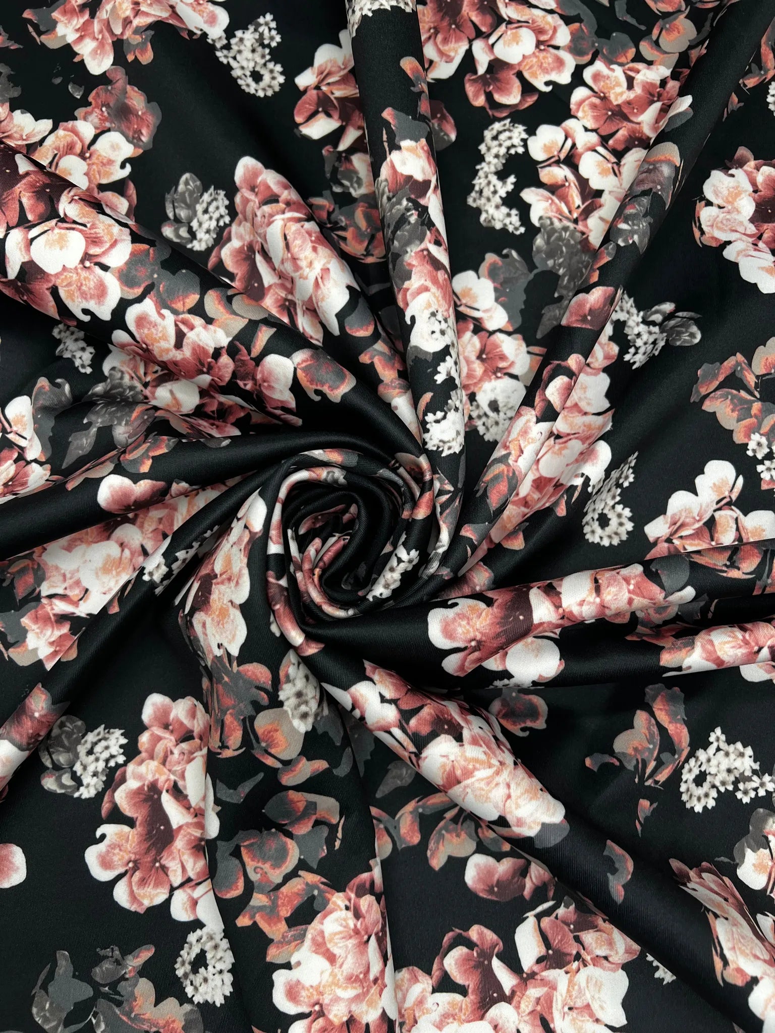 Soft and stretchy black scuba fabric with rose print
