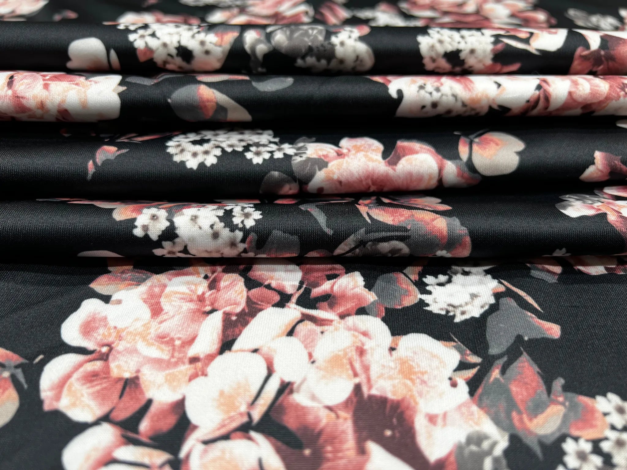 Quality black scuba fabric with delicate rose floral print