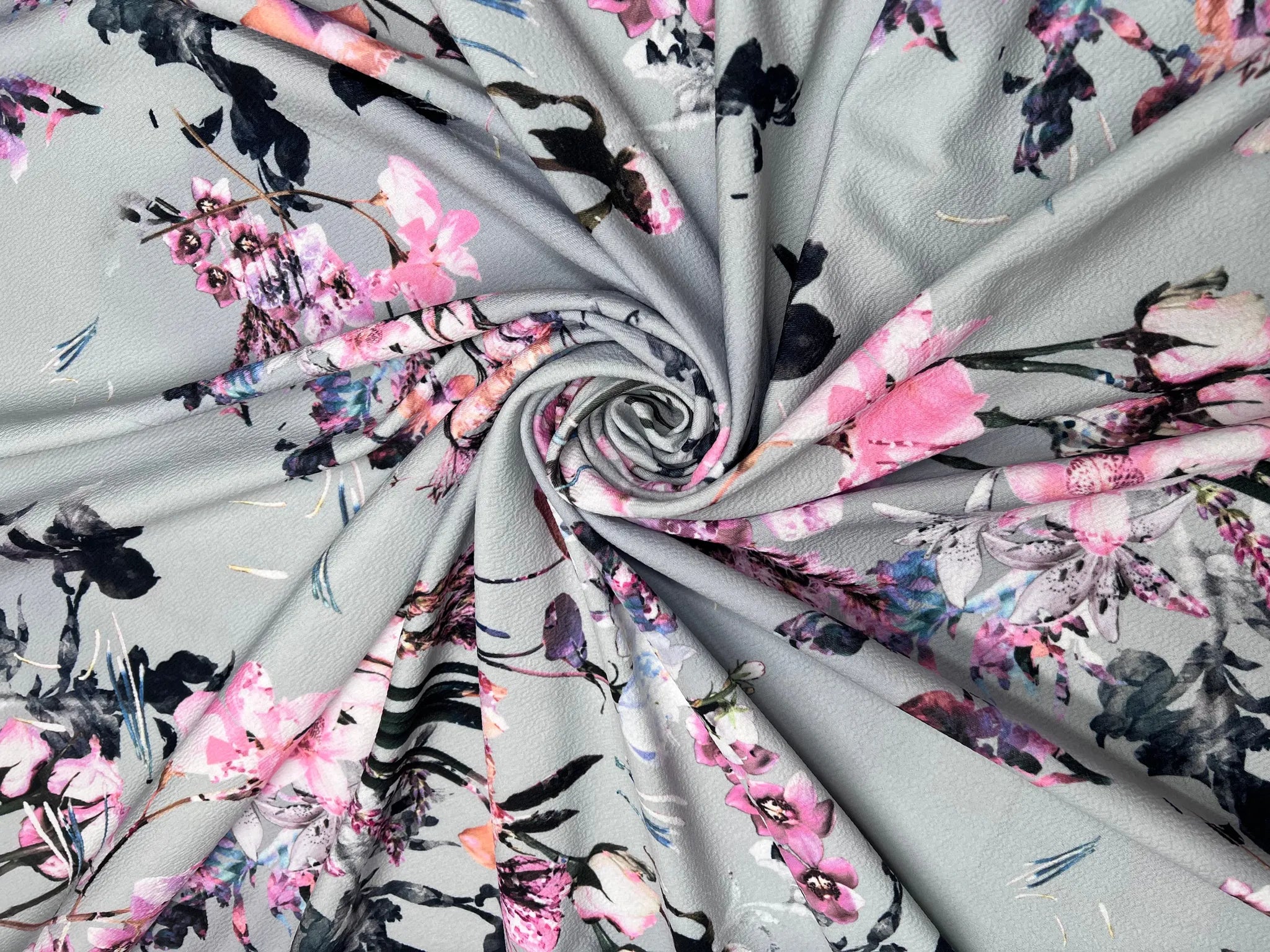 Continuous meter of grey floral pink knit fabric