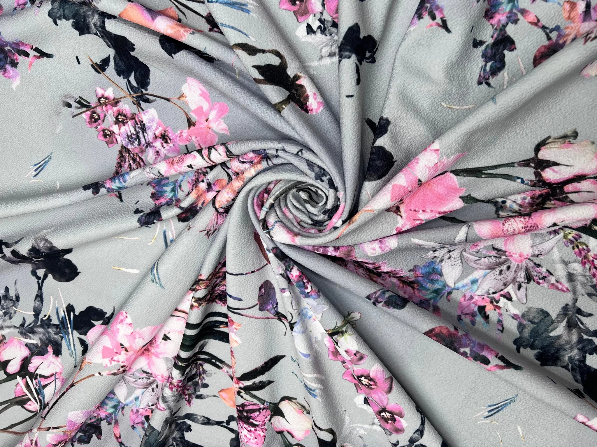 Sewing supplies featuring floral stretch fabric