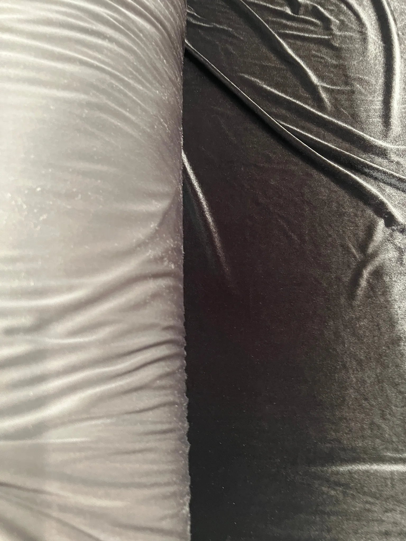 Close-up of soft texture of chocolate brown stretch velvet fabric