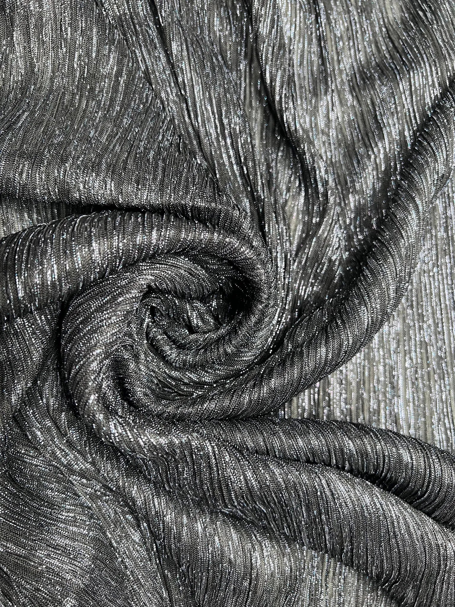 Versatile black plisse jersey fabric for fashionable creations