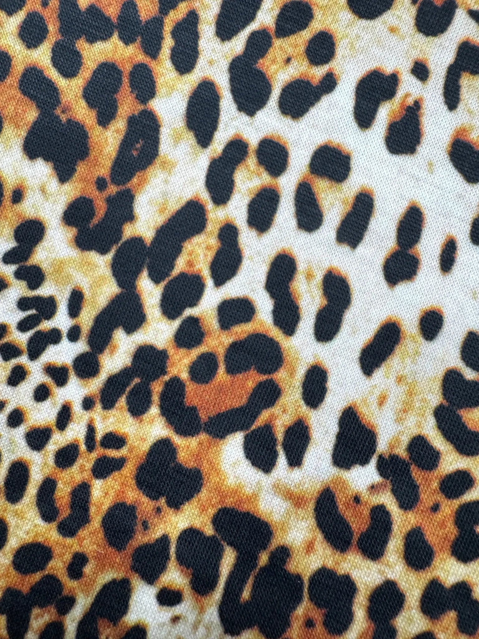 Leopard print jersey fabric in natural tones of beige and brown
