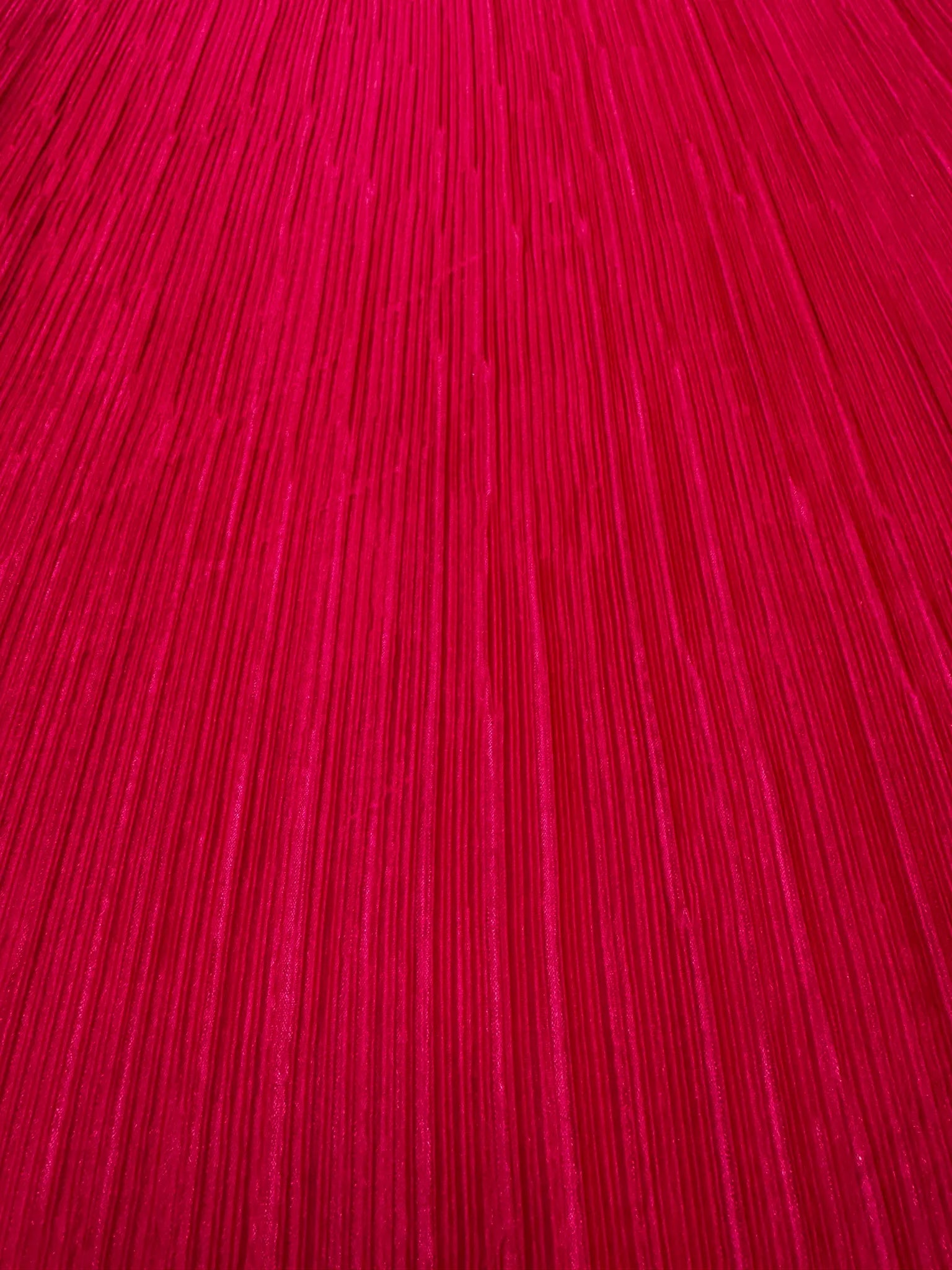 Stylish clothing made from hot pink pleated stretch fabric