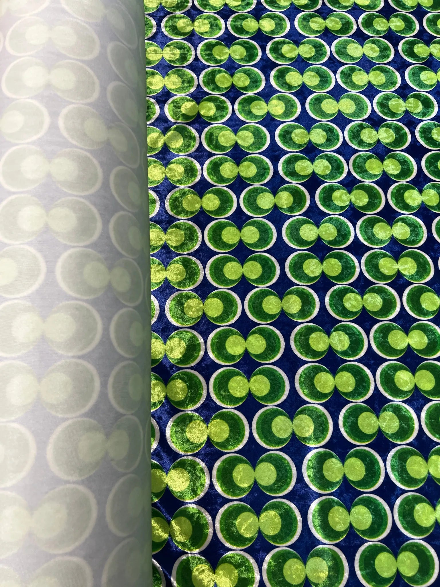Close-up of vibrant circle print on velvet fabric