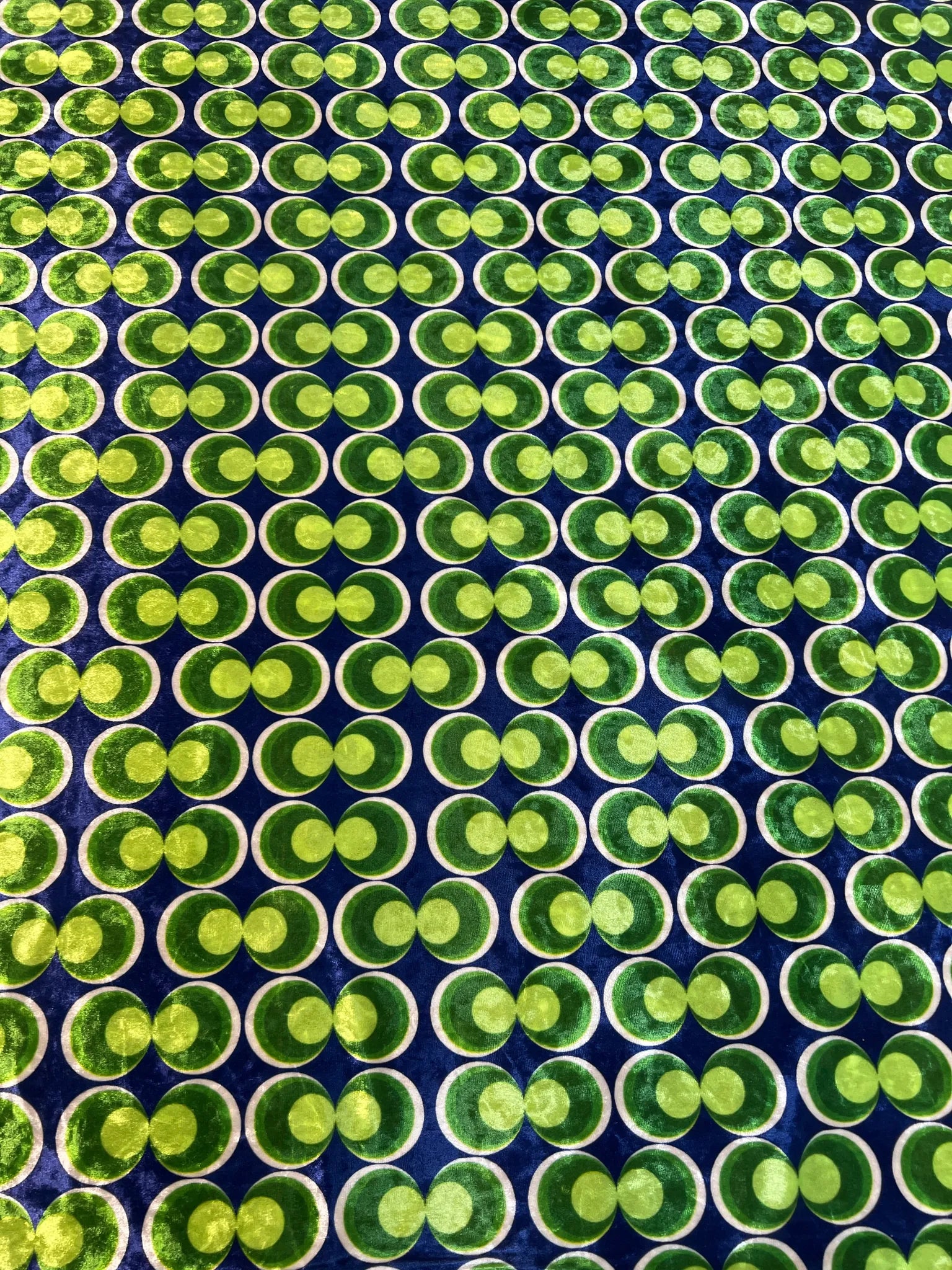 Vibrant retro geometric stretch velvet fabric in use