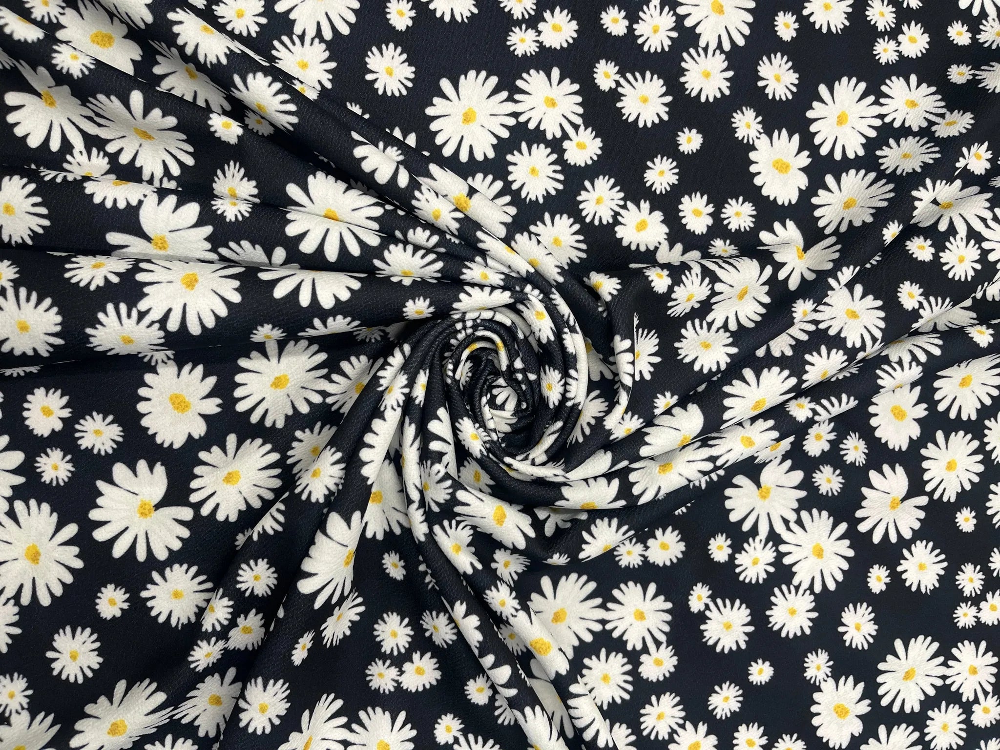 Black Daisy Floral Liverpool fabric on display with white daisies