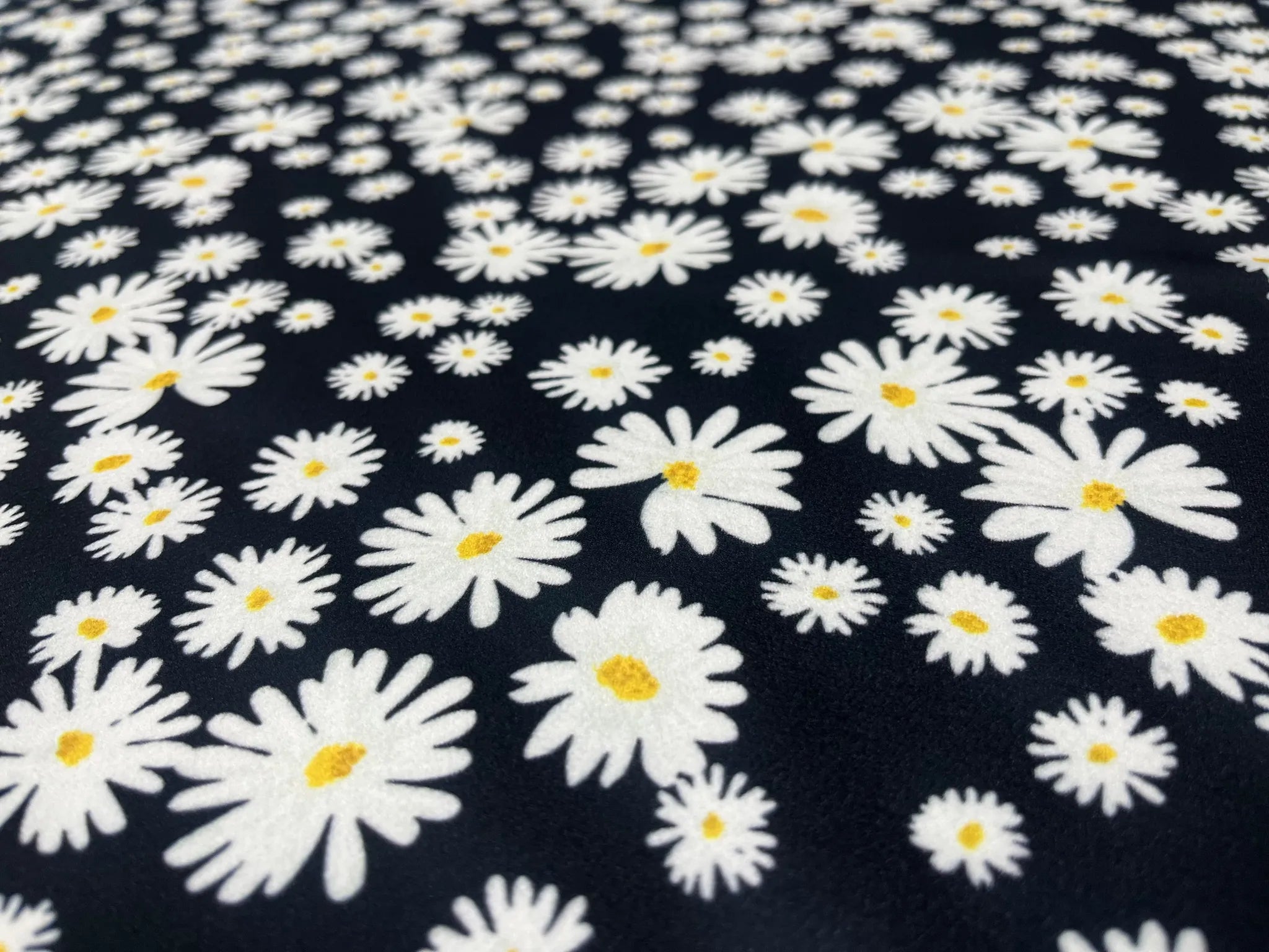Black Daisy Floral Liverpool fabric draped elegantly