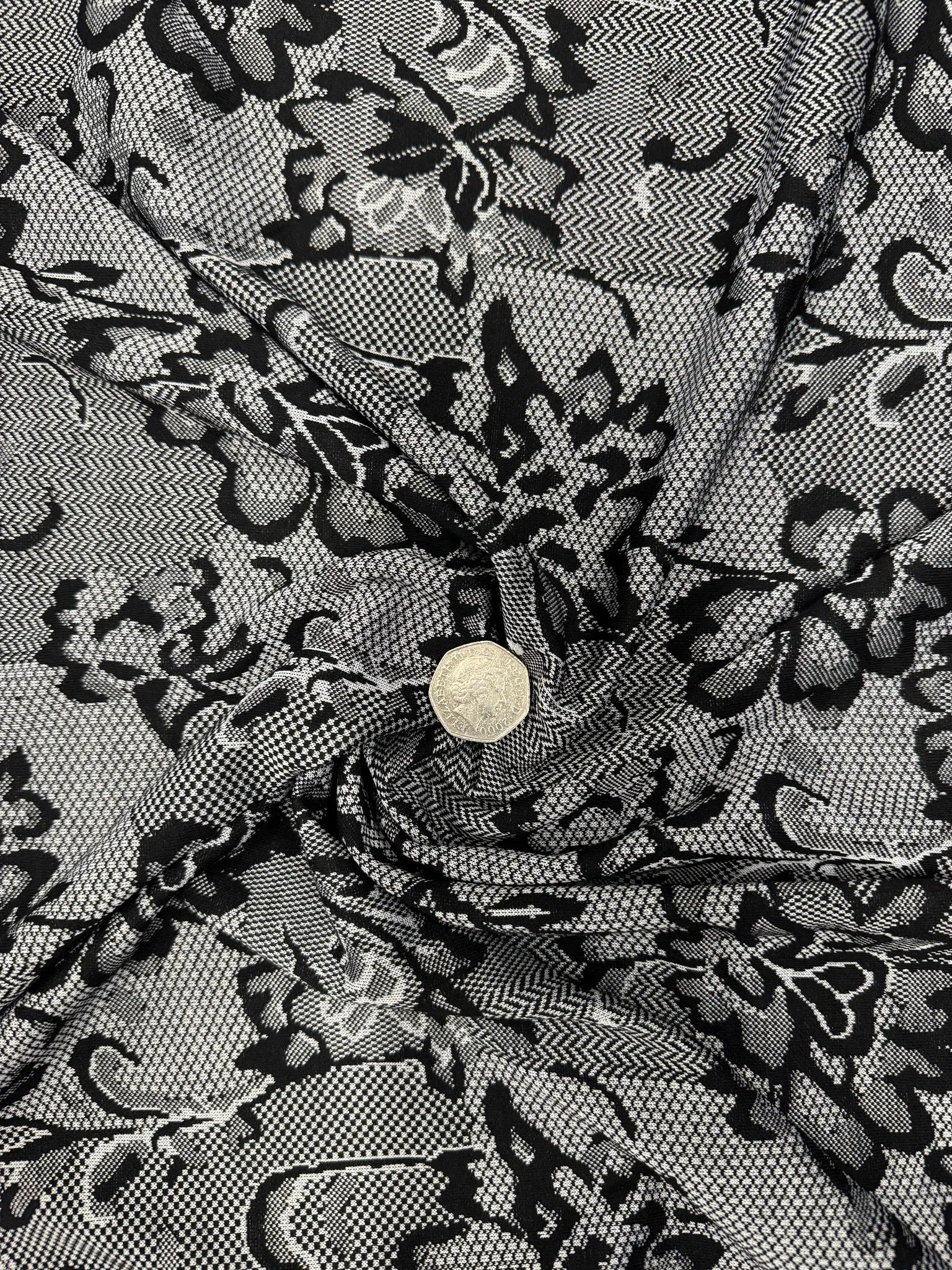 Elegant dress made from black and white lace print jersey fabric